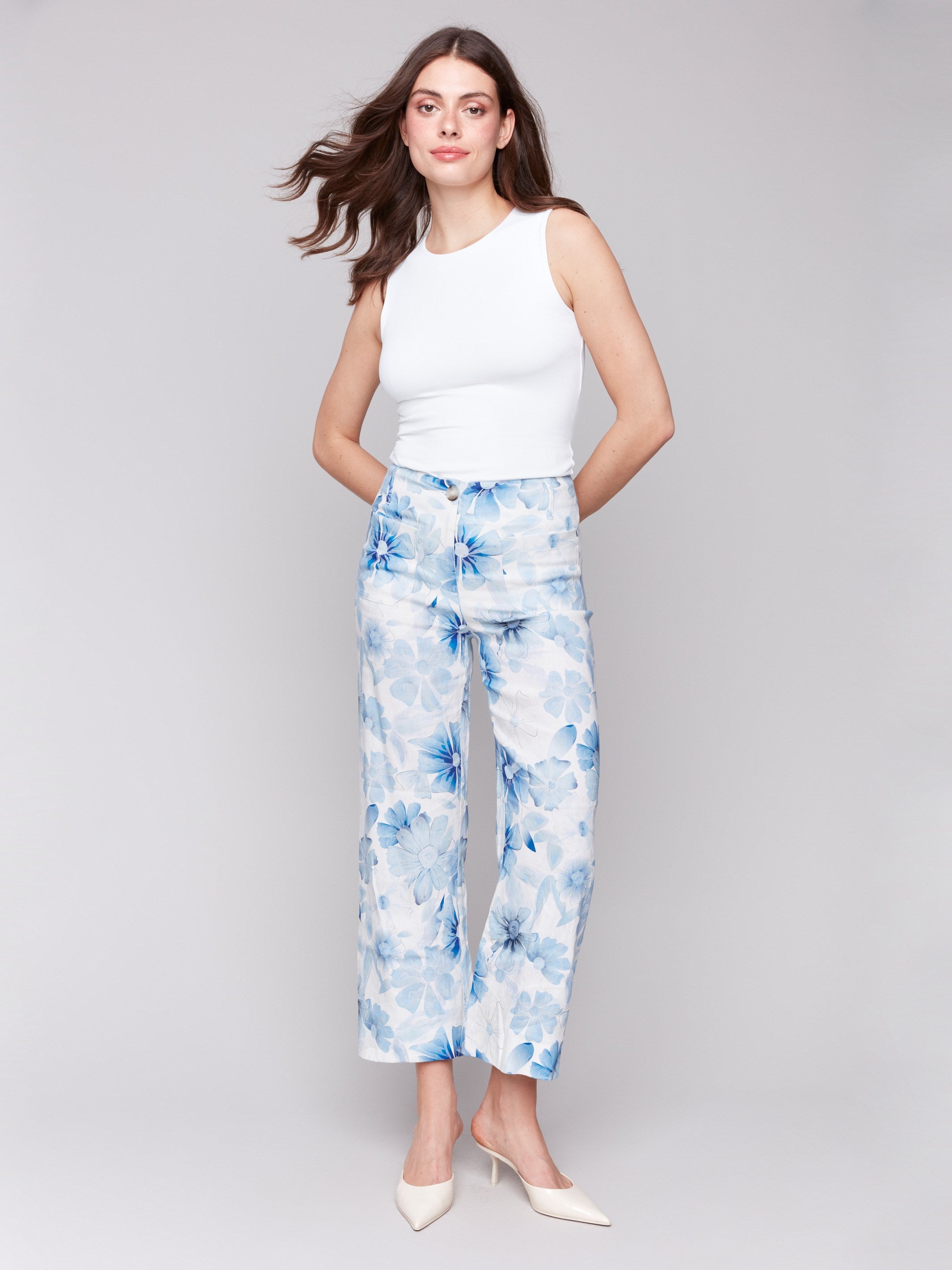 Cropped pants with patch pockets in a celestial floral design by Charlie B.