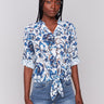 Blue blouse with a V-neckline and floral pattern by Charlie B.