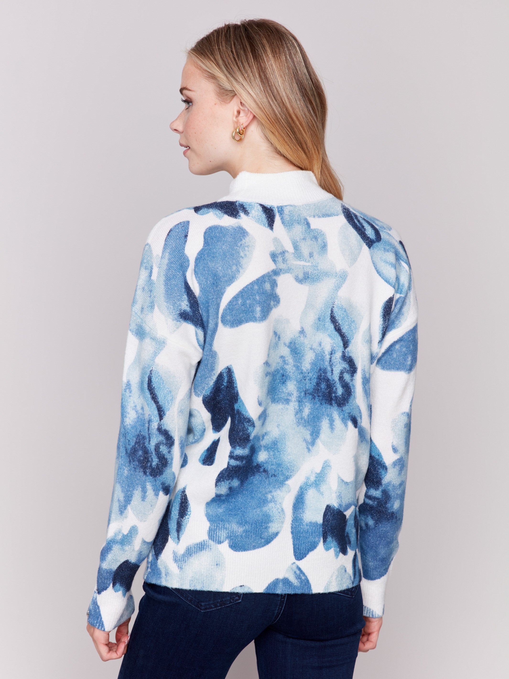 Navy storm blue sweater with abstract print and mock neck, featuring zippers on sleeves by Charlie B.