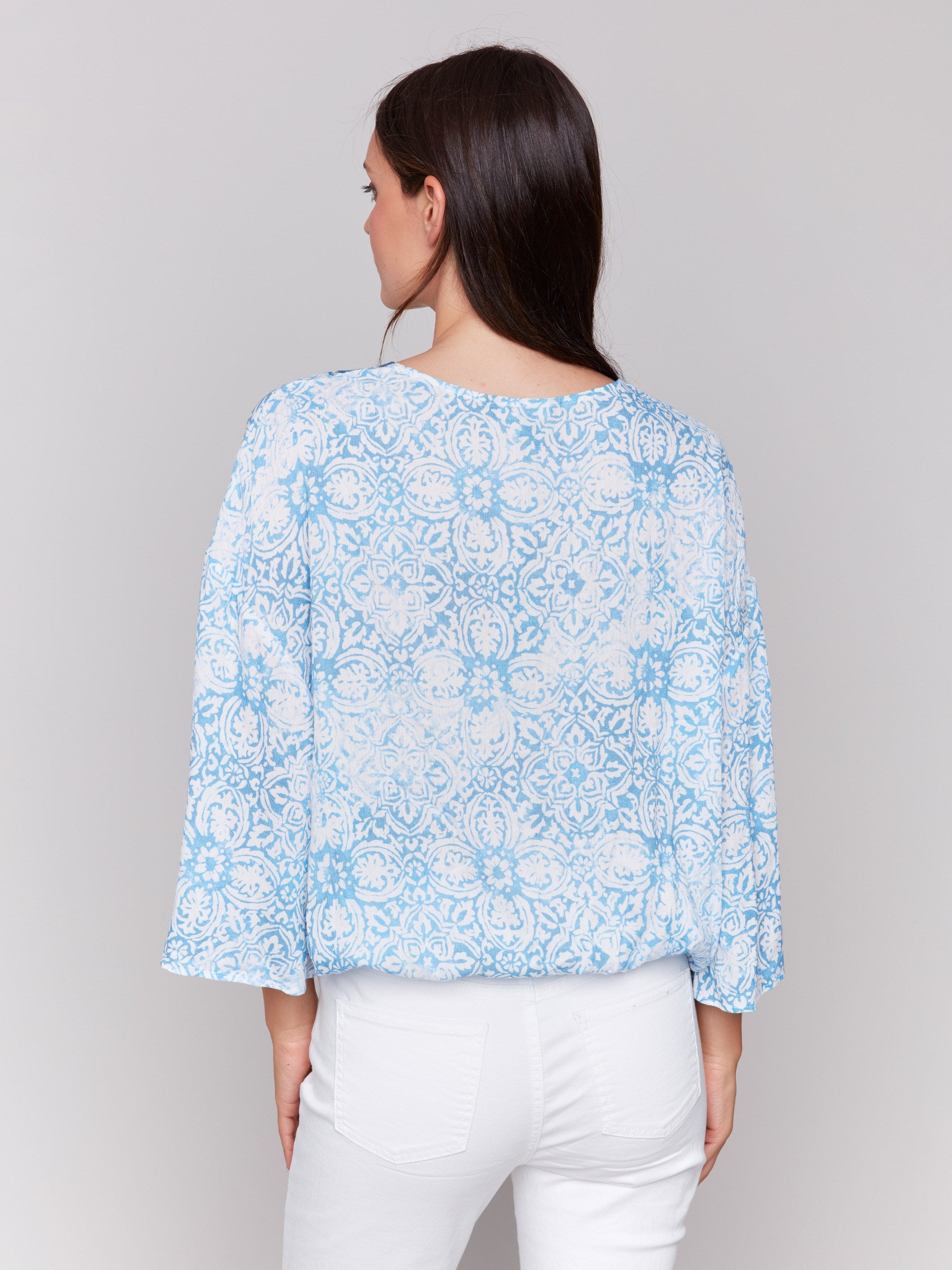 Blue blouse featuring 3/4 wide sleeves by Charlie B.