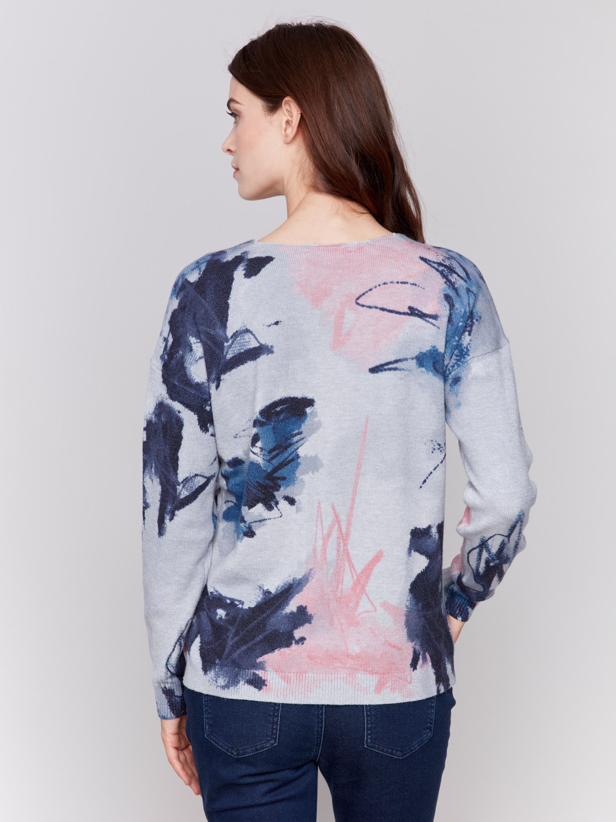 Light grey V-neck sweater with an abstract print and drop shoulders by Charlie B.