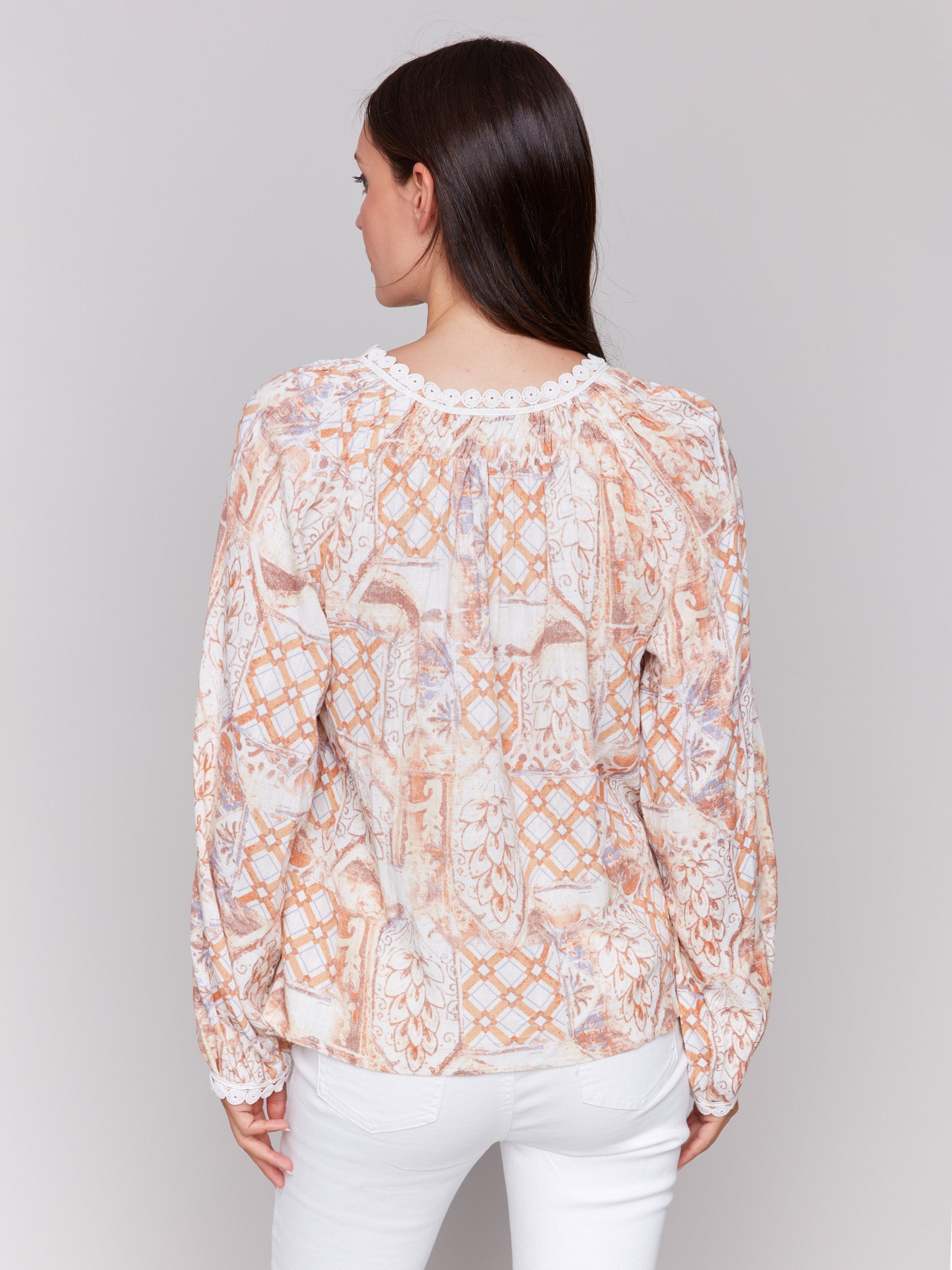 Geometric floral printed blouse in vibrant papaya shade with elegant accents by Charlie B.