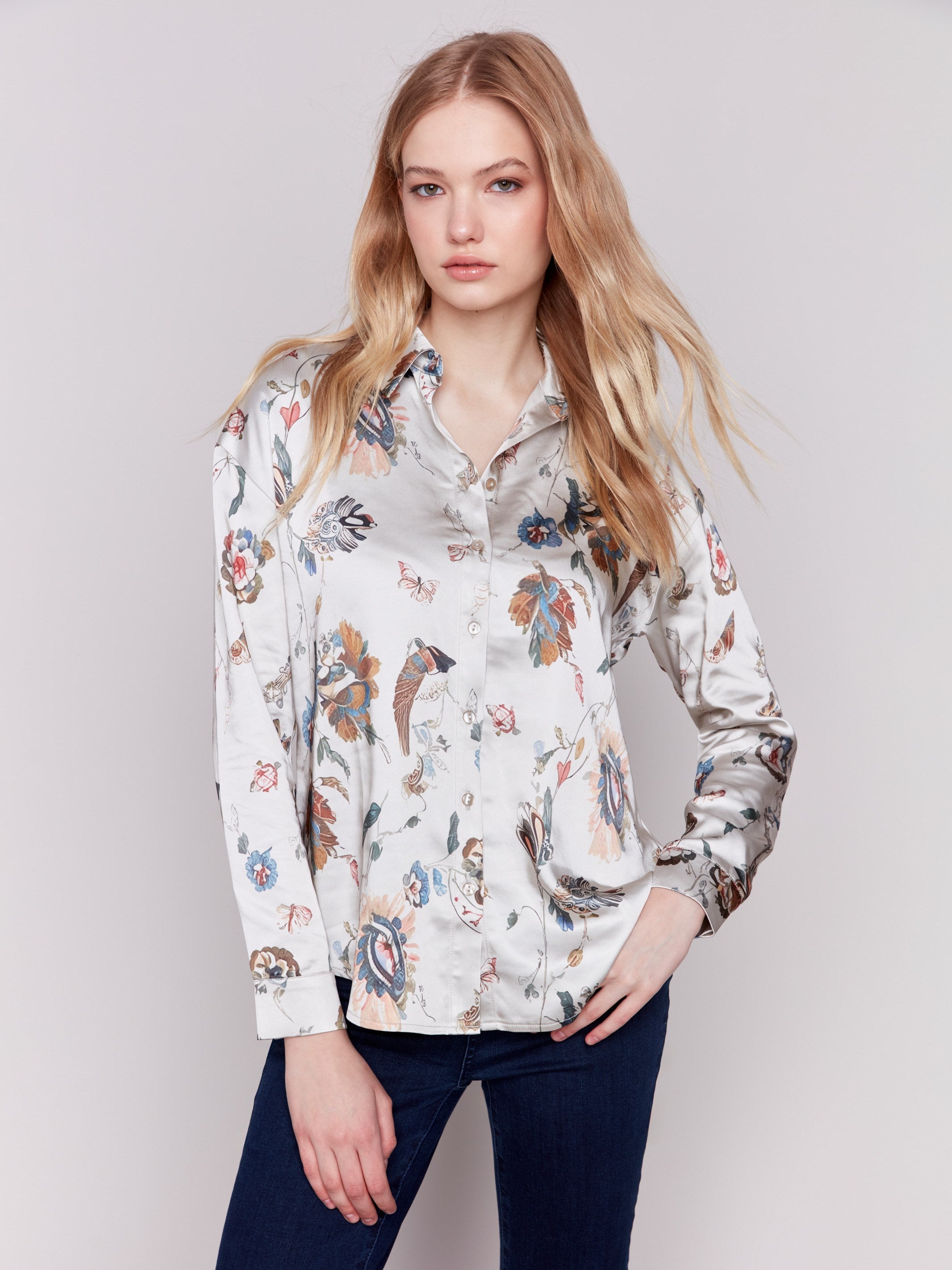 Satin button-down shirt featuring a floral pattern and long sleeves with a classic shirt collar by Charlie B.