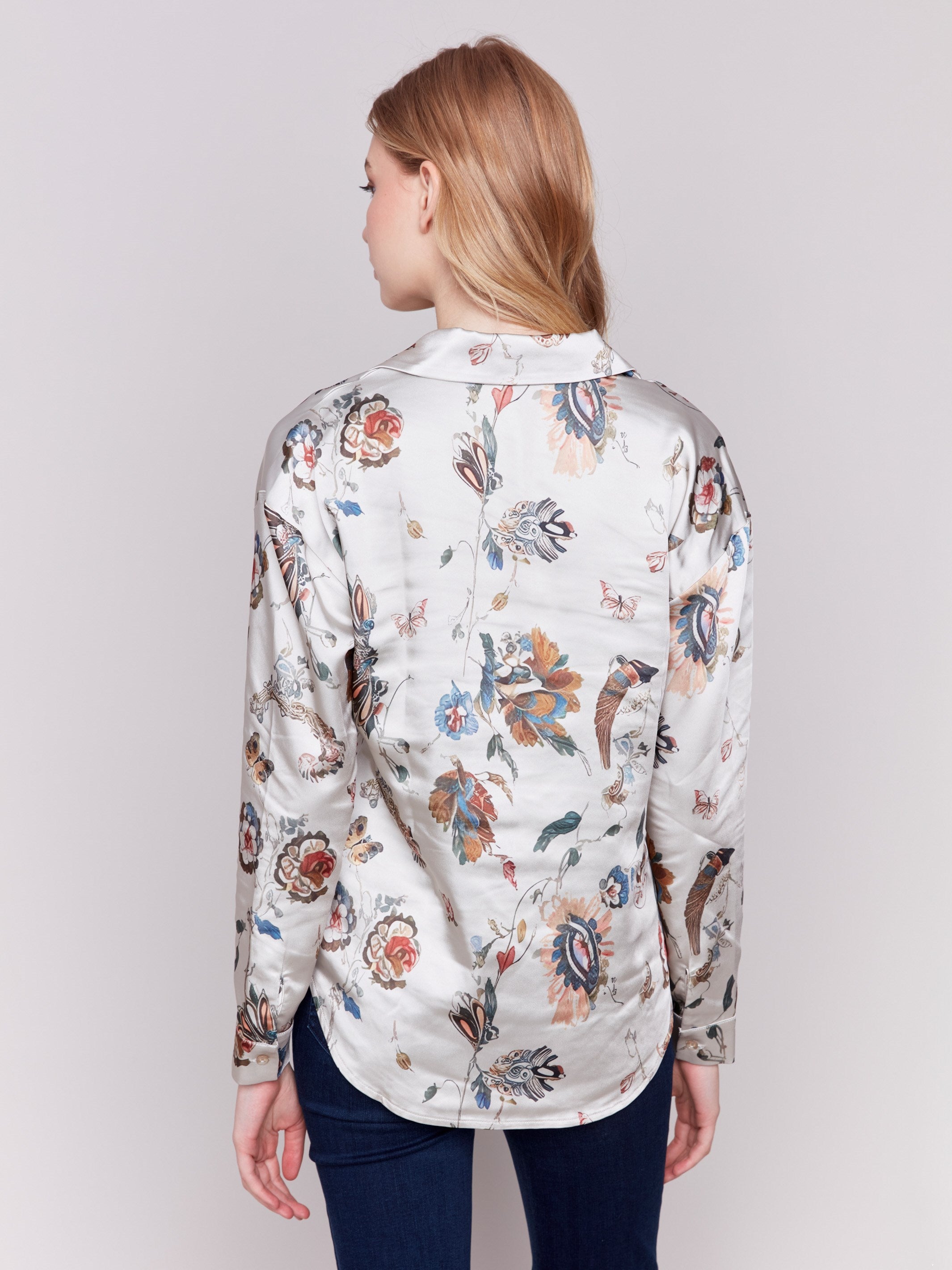 Satin button-down shirt featuring a floral pattern and long sleeves with a classic shirt collar by Charlie B.