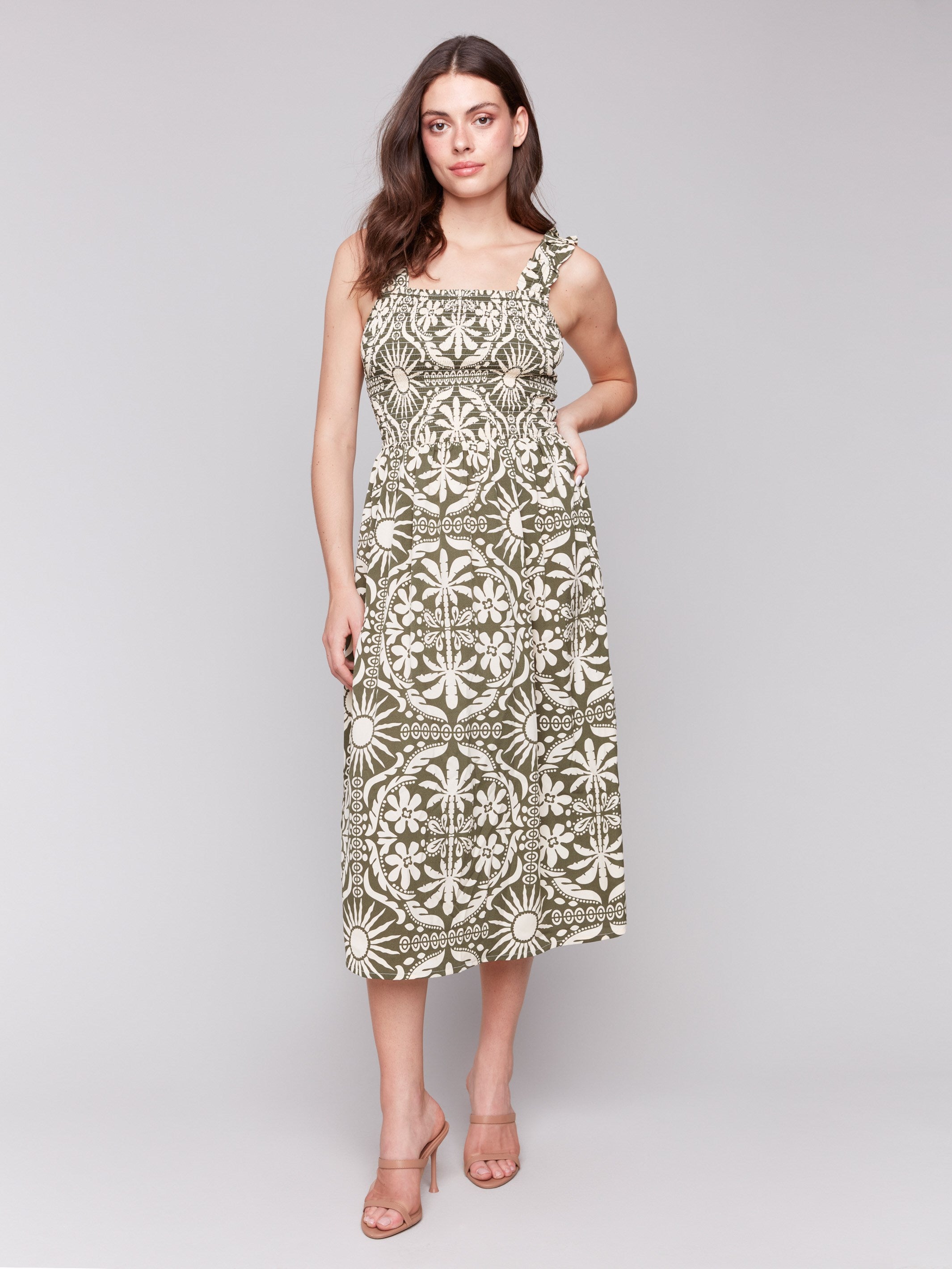 Celadon-green dress featuring a mid-calf length and graphic pattern by Charlie B.