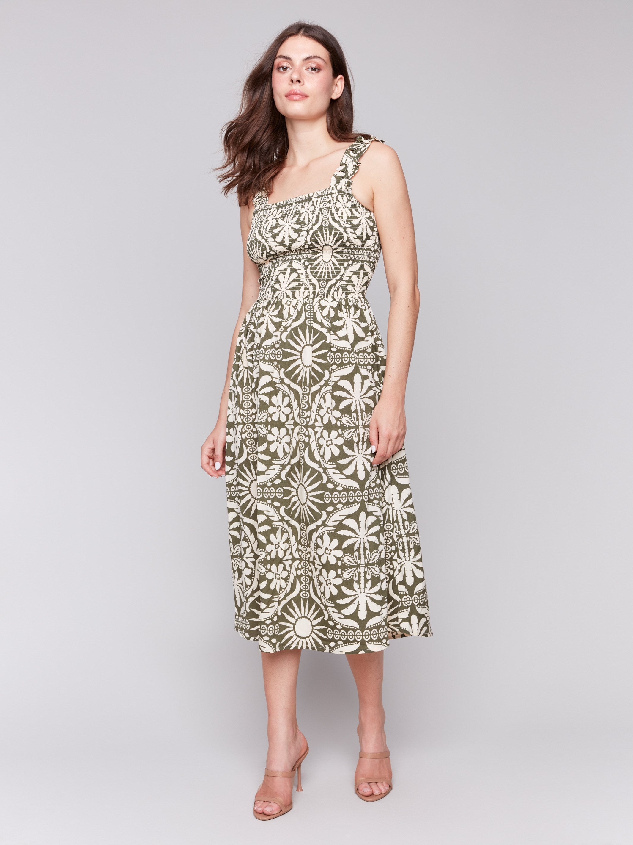 Square neckline adds elegance to the celadon-green artistic print dress by Charlie B.