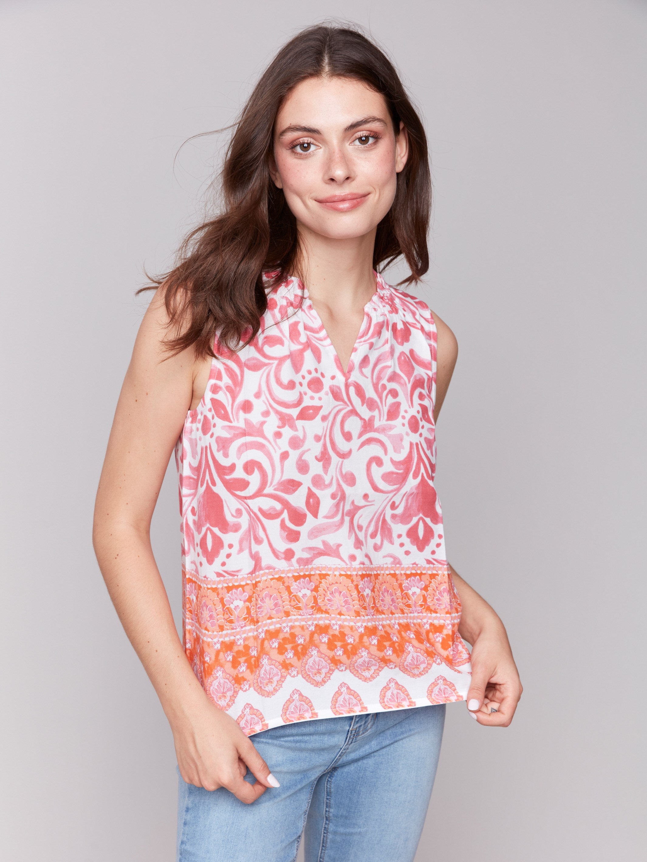 Printed sleeveless top with unique design elements by Charlie B.