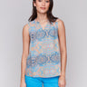 Blue and orange blouse featuring an intricate abstract pattern by Charlie B.