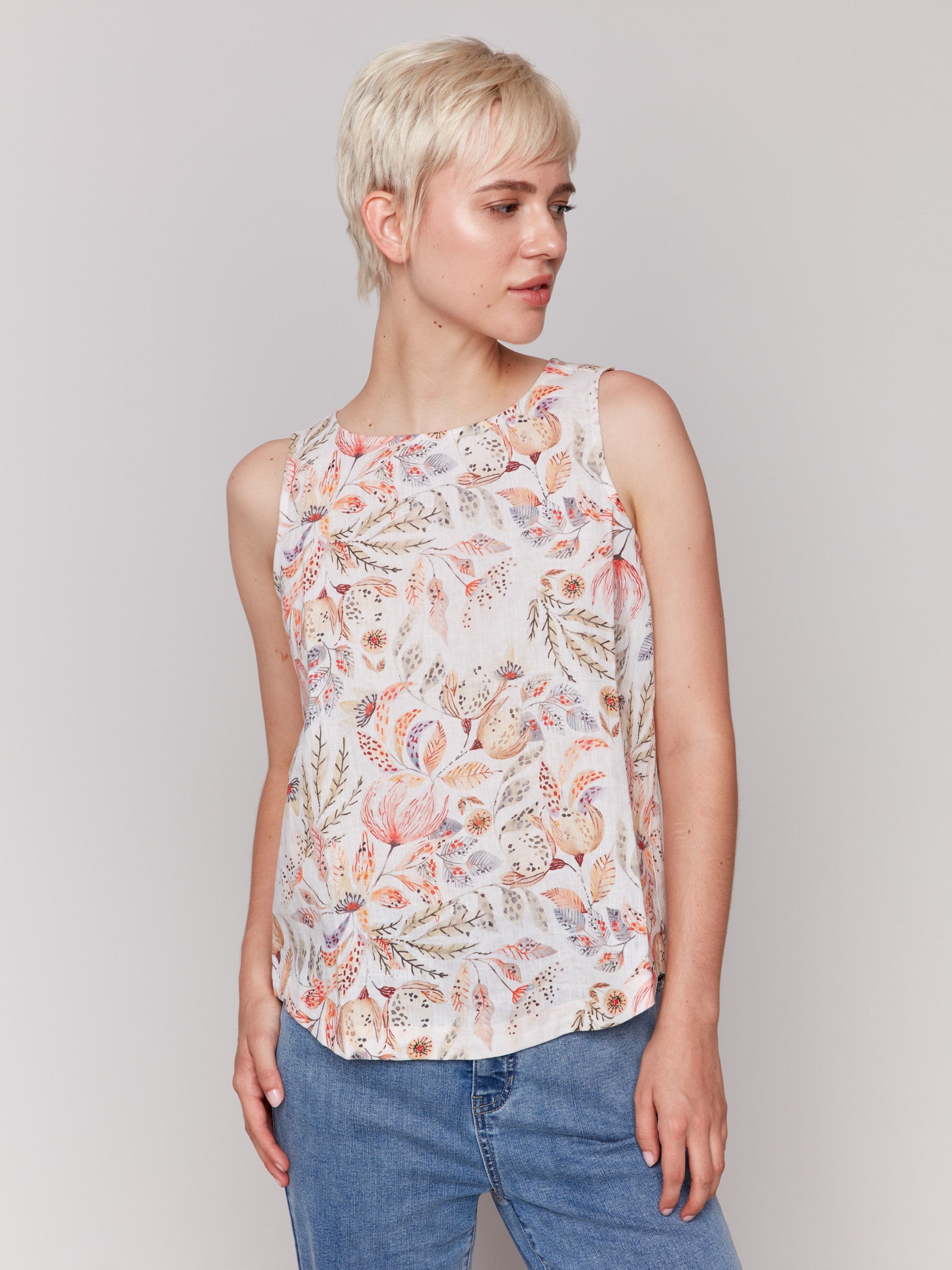 Floral sleeveless top featuring a crew neckline by Charlie B.