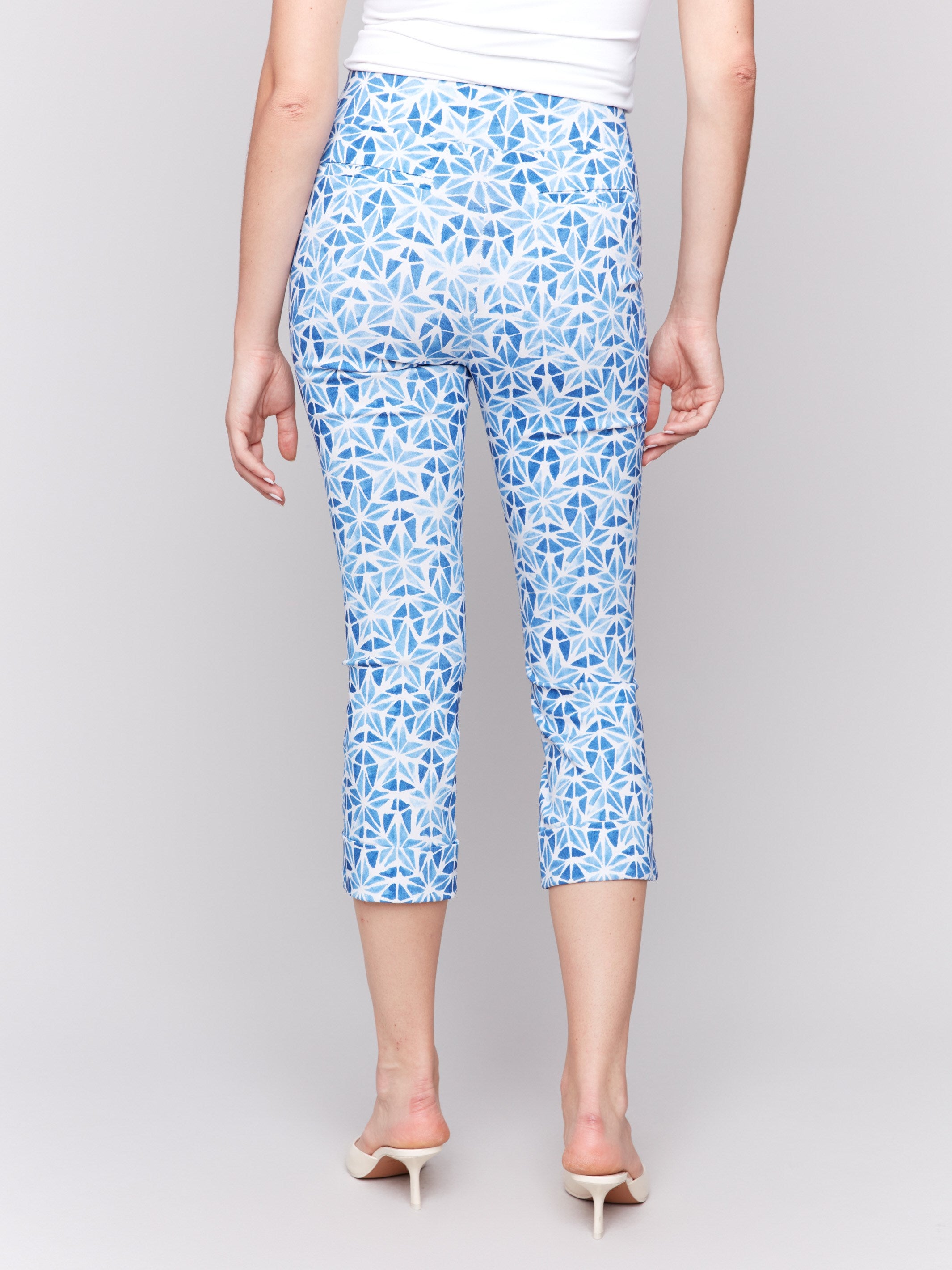 Blue capri pants with folded cuffs and star design by Charlie B.