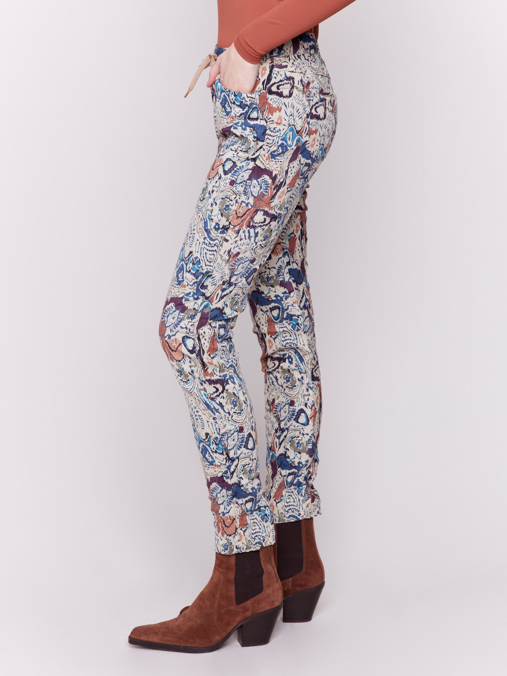 Jogger pants in an abstract print with a crinkled texture and pull-on waist.