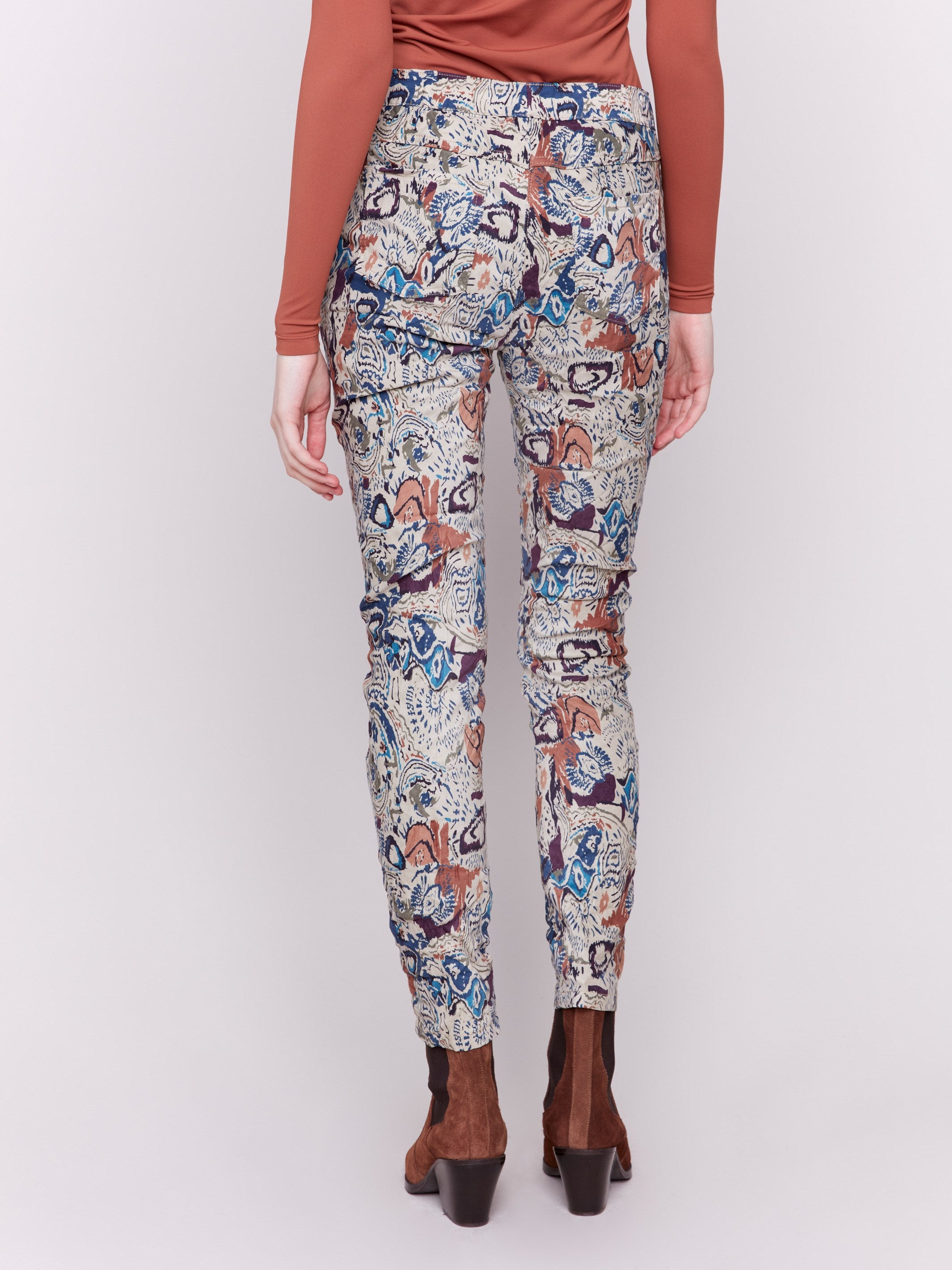 Jogger pants in an abstract print with a crinkled texture and pull-on waist.