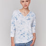 White V-neck knit top with denim tie-dye effect and drop shoulders by Charlie B.