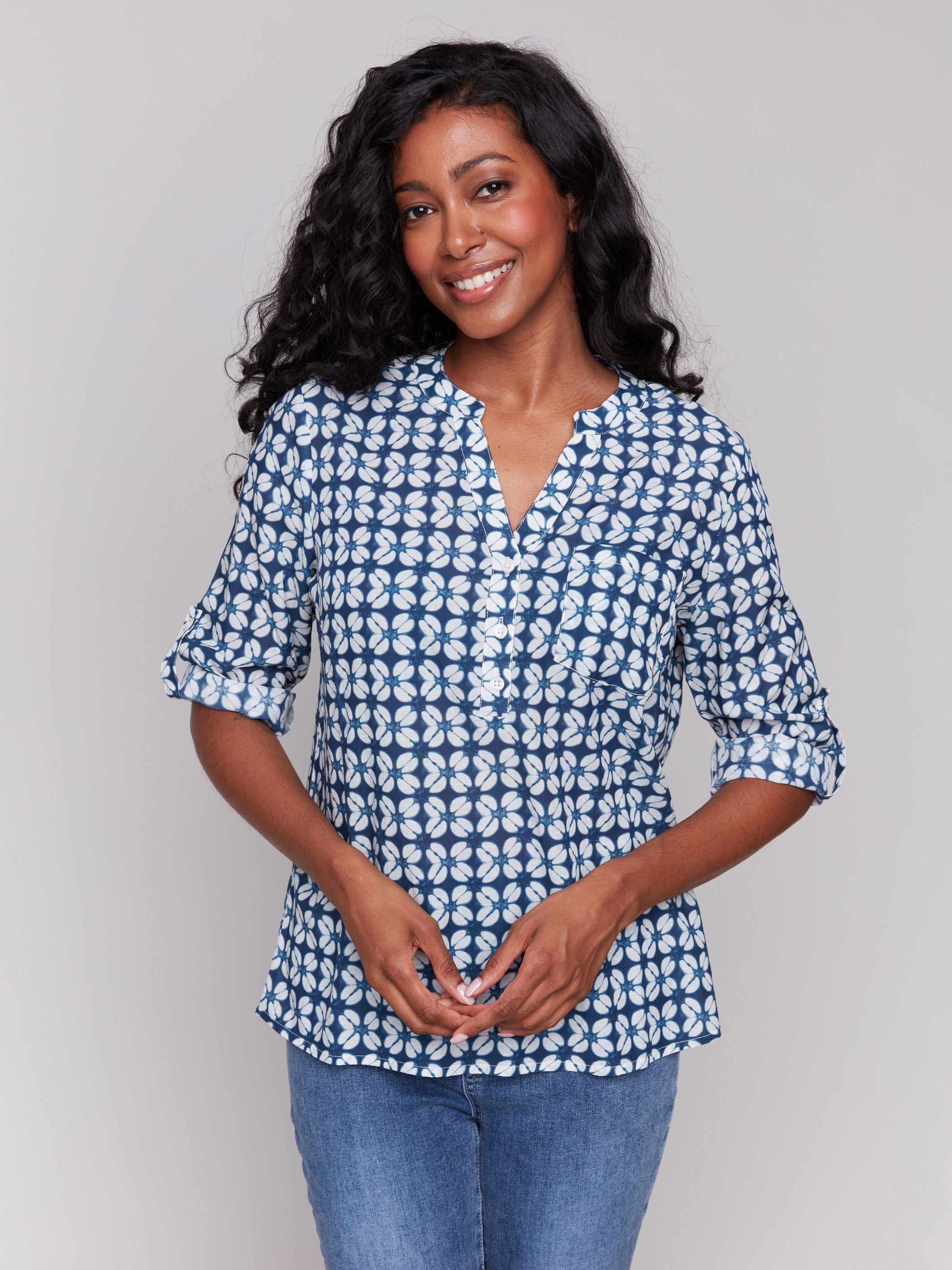 Blue blouse with relaxed fit and geometric pattern, featuring adjustable roll-up sleeves by Charlie B.