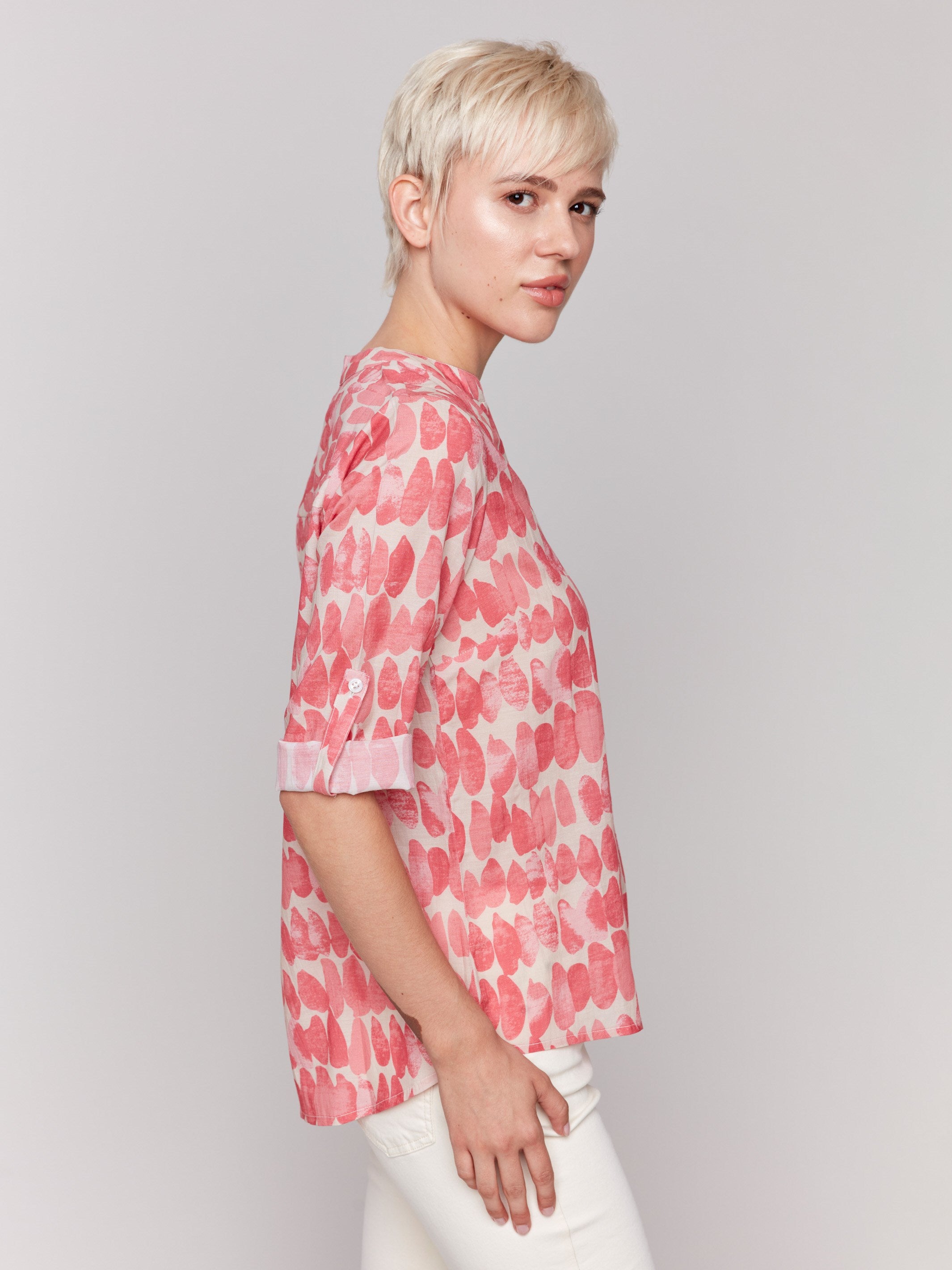 Blouse with a relaxed fit and red and white drops print by Charlie B.