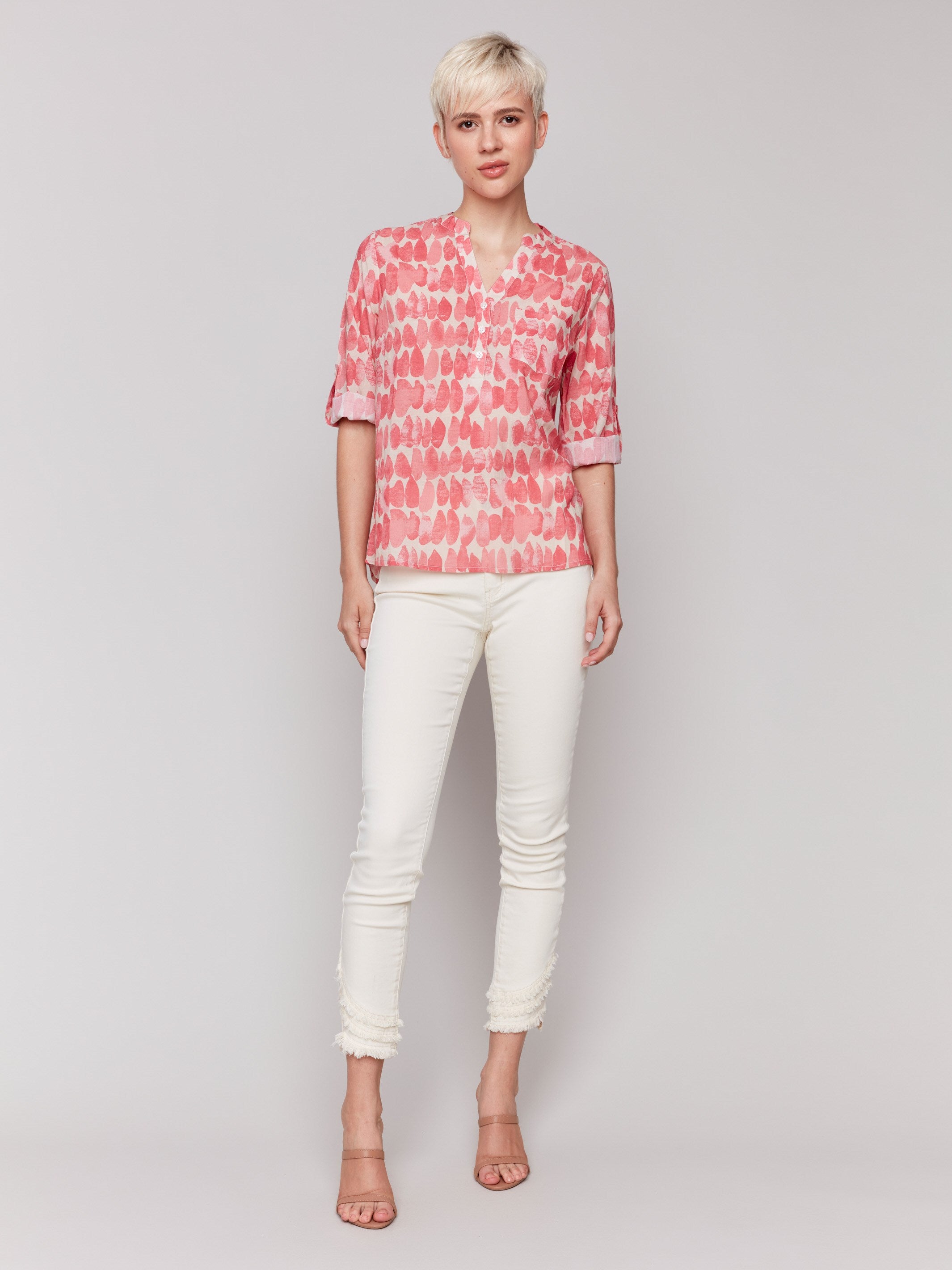 Half-button design blouse featuring a unique abstract pattern by Charlie B.