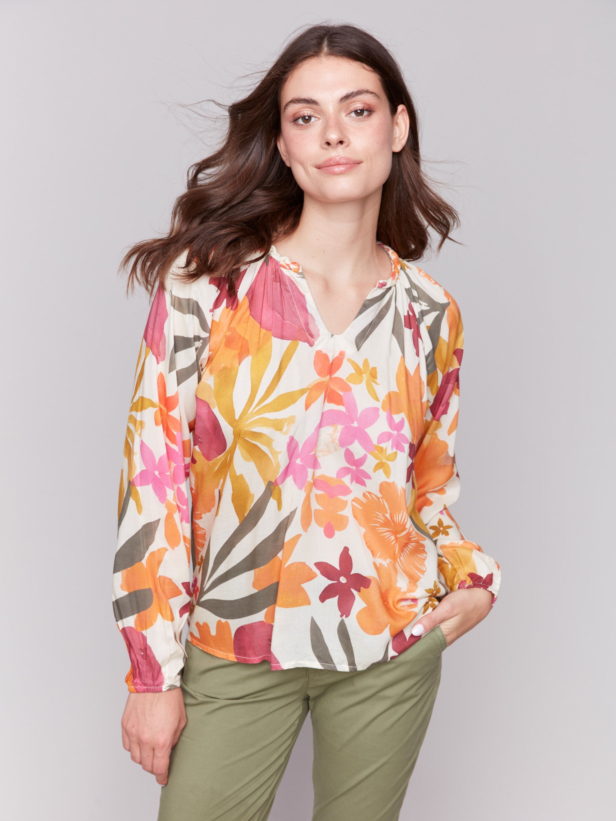 V-neck popover blouse with vibrant floral design by Charlie B.