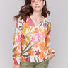 V-neck popover blouse with vibrant floral design by Charlie B.