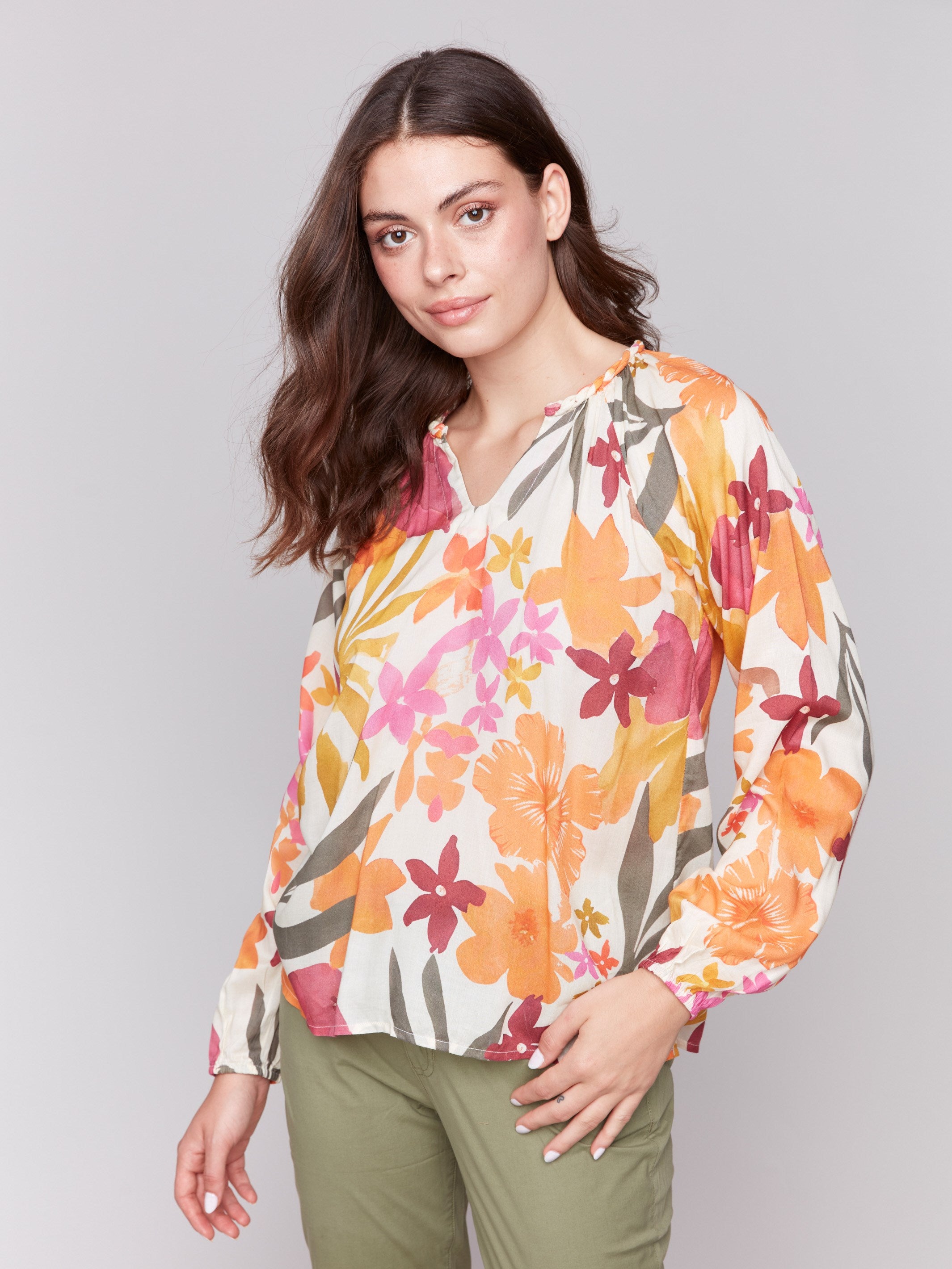 Raglan long sleeves add charm to this printed blouse by Charlie B.