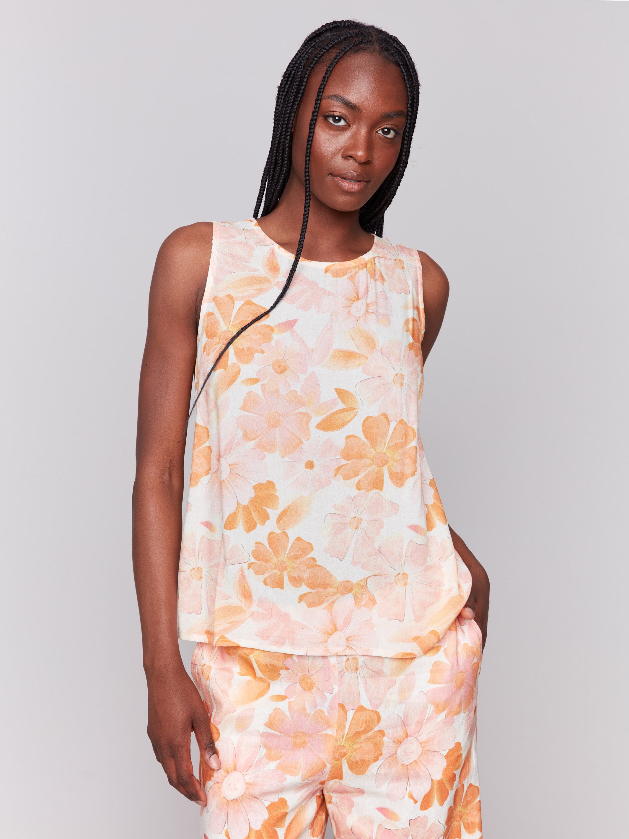 Floral pattern sleeveless top with a crew neckline by Charlie B.