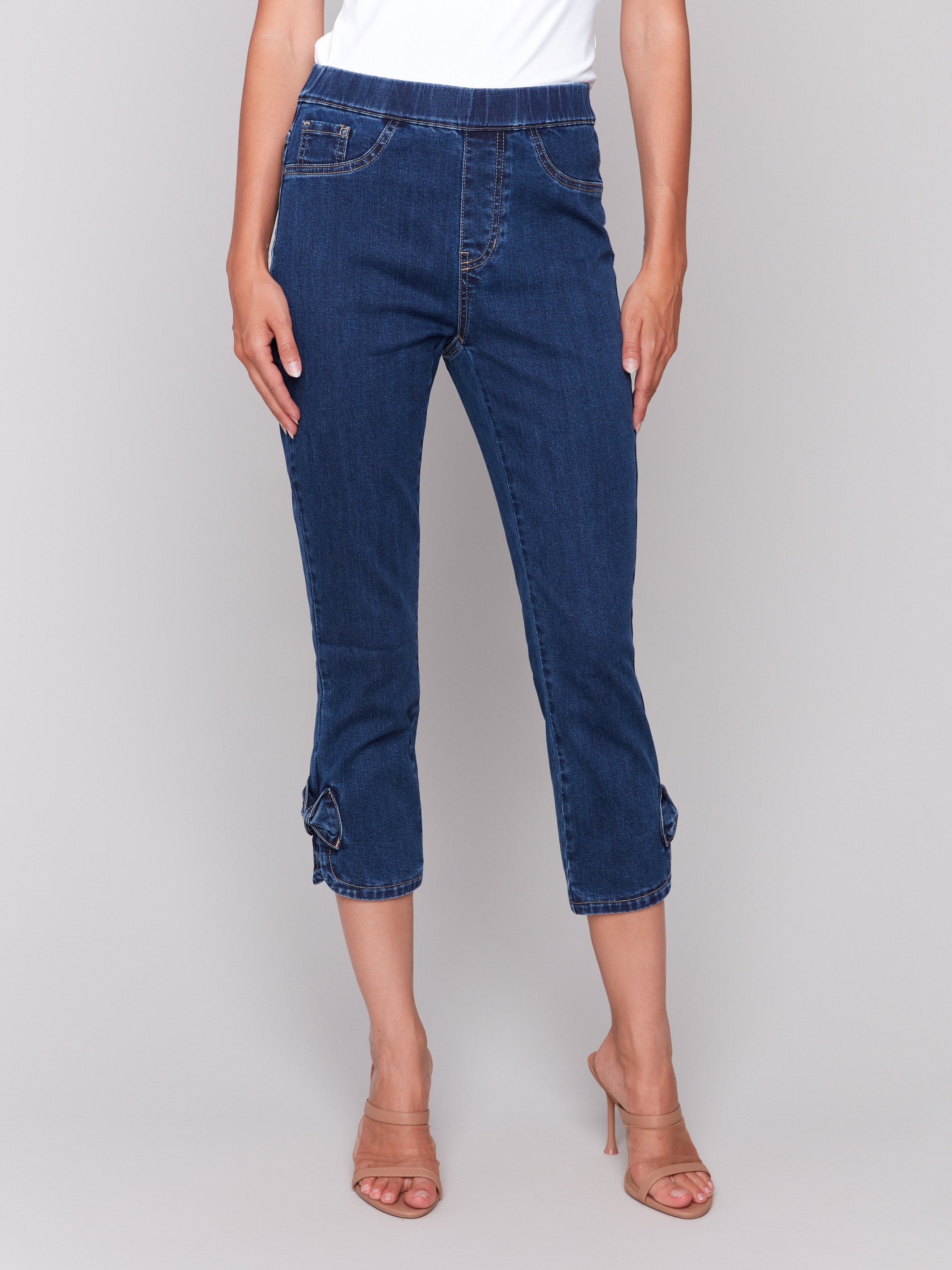 Jeans featuring a regular rise waist and two functional back pockets by Charlie B.