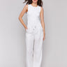 White pants with a wide leg fit and utility pockets by Charlie B.