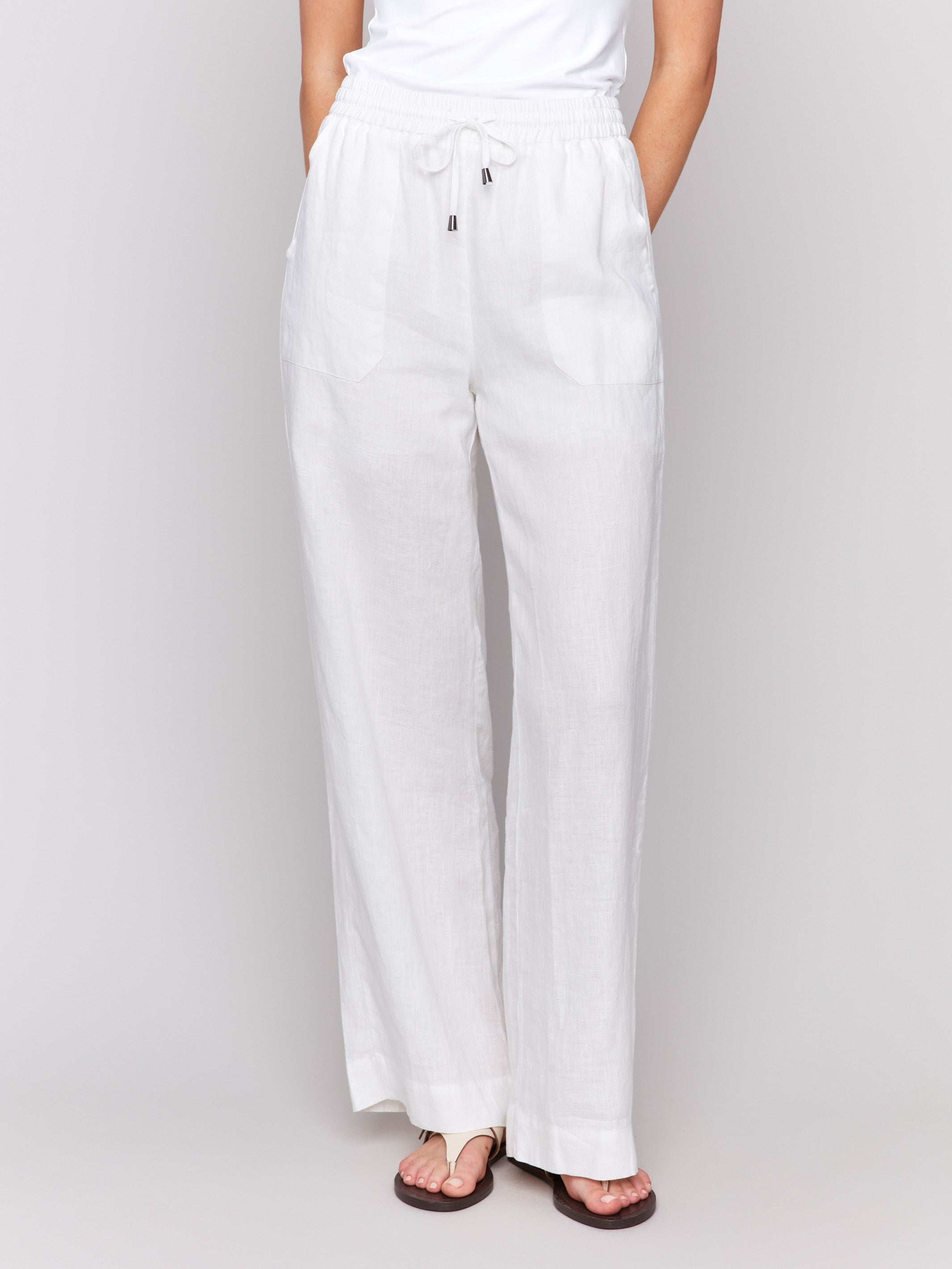 White pants featuring a front tie waistband for style by Charlie B.