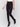 Black slim-leg pants with a regular rise, featuring a slit detail and an elastic waistband by Charlie B.