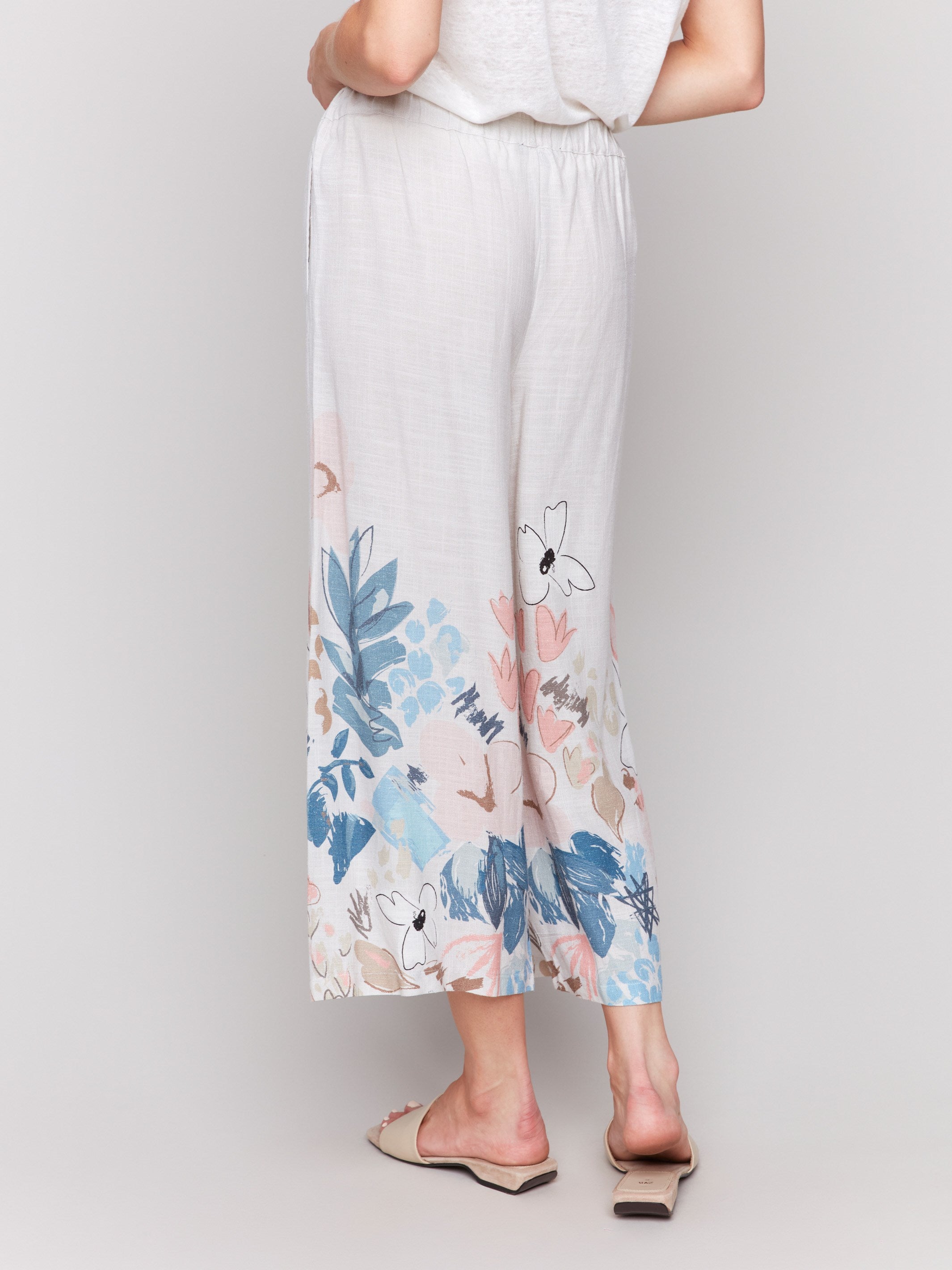 Floral patterned cropped linen blend trousers with an adjustable waist by Charlie B.