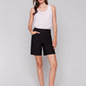 Black shorts featuring a mid-rise waist by Charlie B.