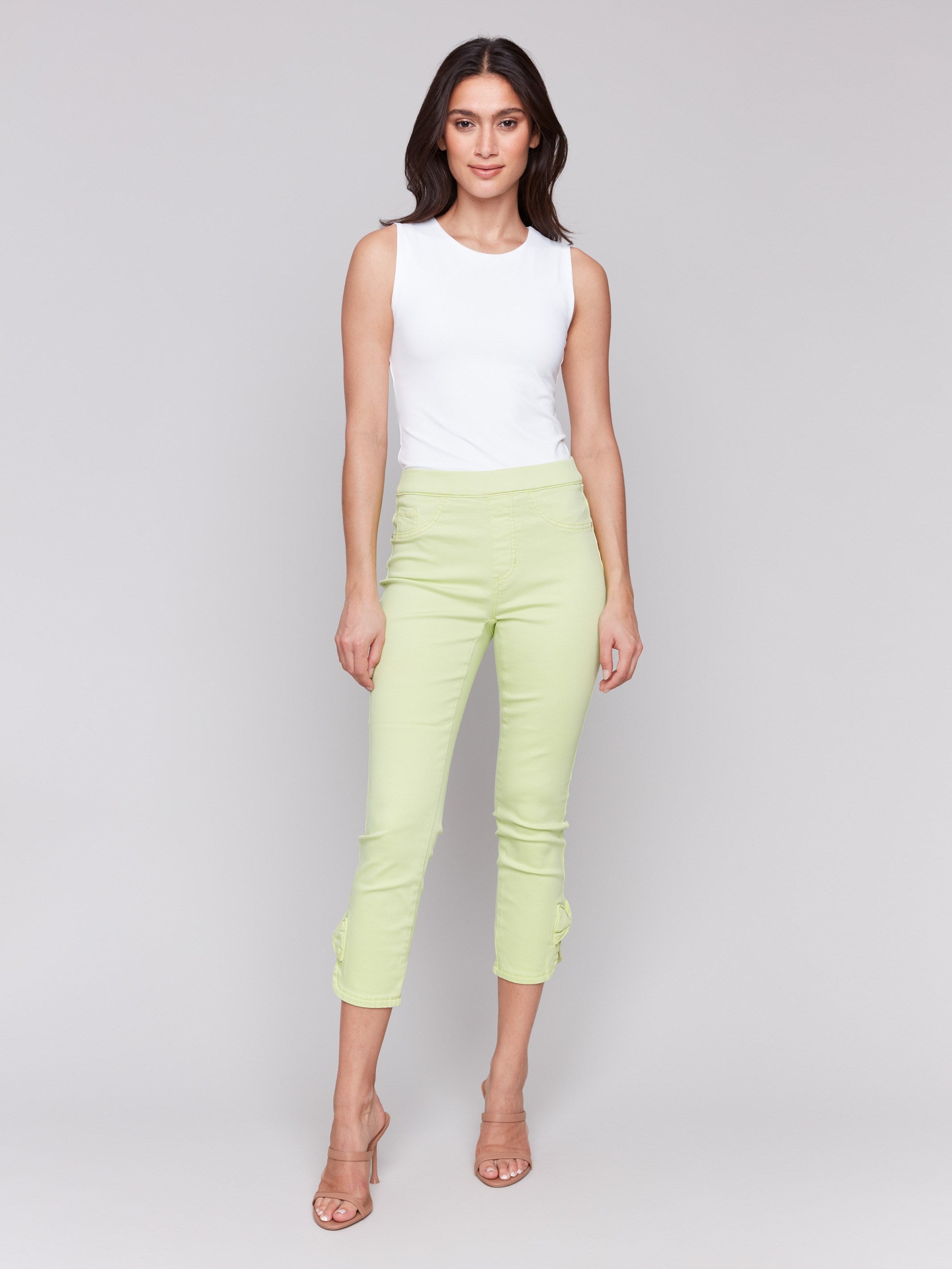 Light green pants with slim leg design, ideal for versatile styling by Charlie B.