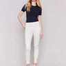 Pull-on twill pants in natural color with snap button hem, slim leg, and regular rise by Charlie B.