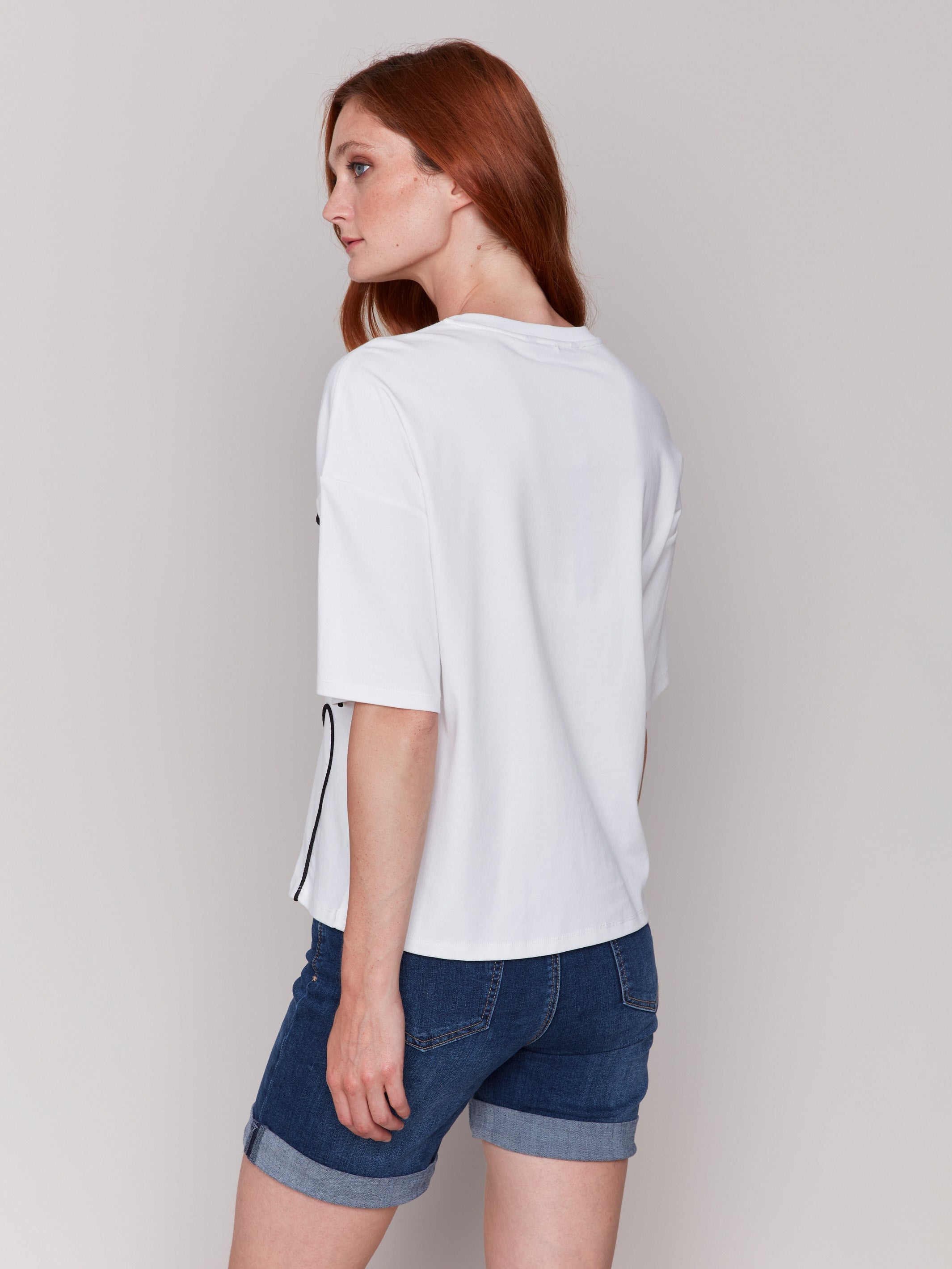 Crew neck white t-shirt showcasing stylish front detailing by Charlie B.