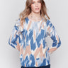 Truffle and blue reversible sweater with an abstract pattern, featuring raglan sleeves and a crew neckline by Charlie B.