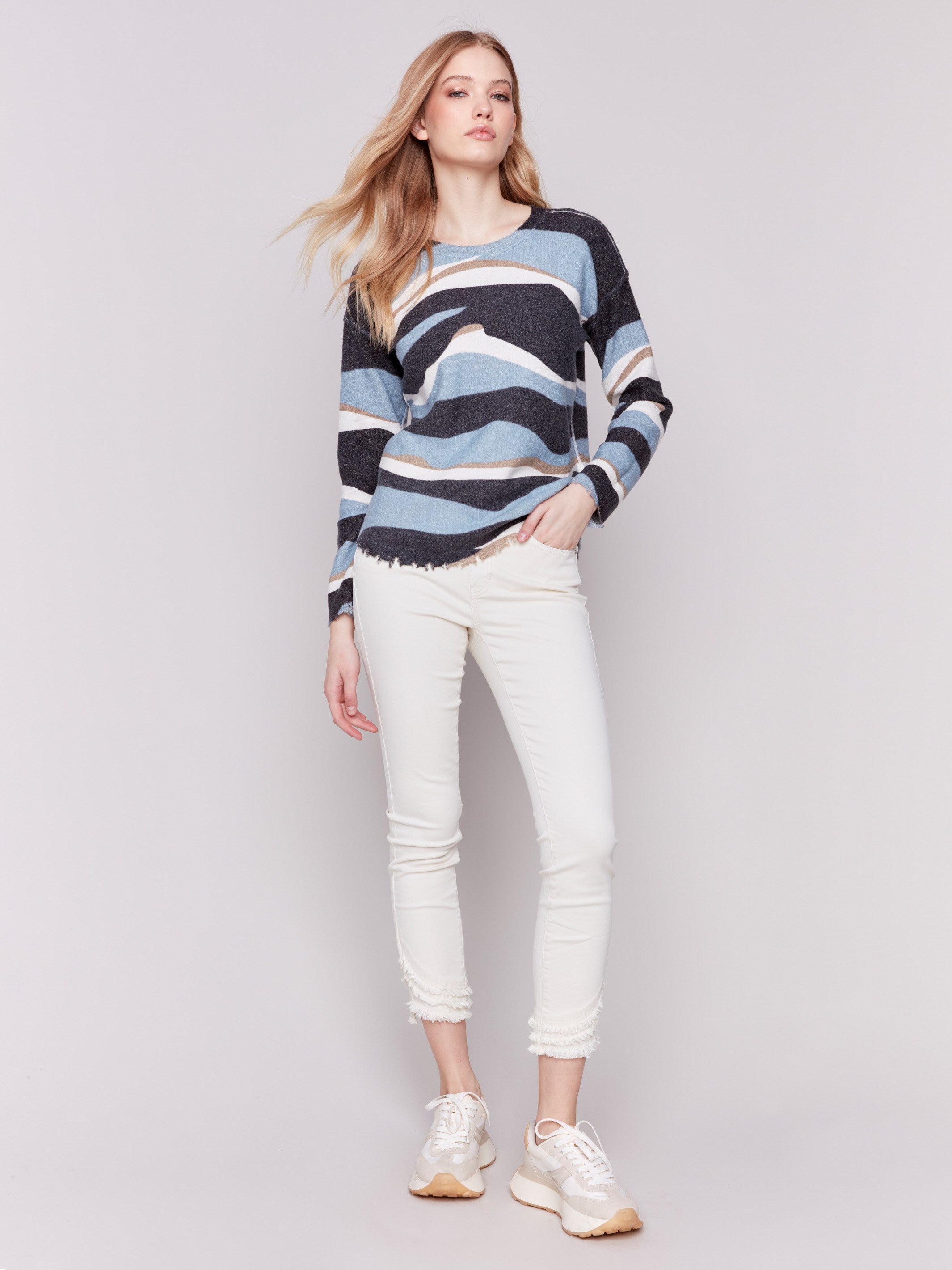 Reversible denim printed plush sweater with frayed edges and boatneck by Charlie B.