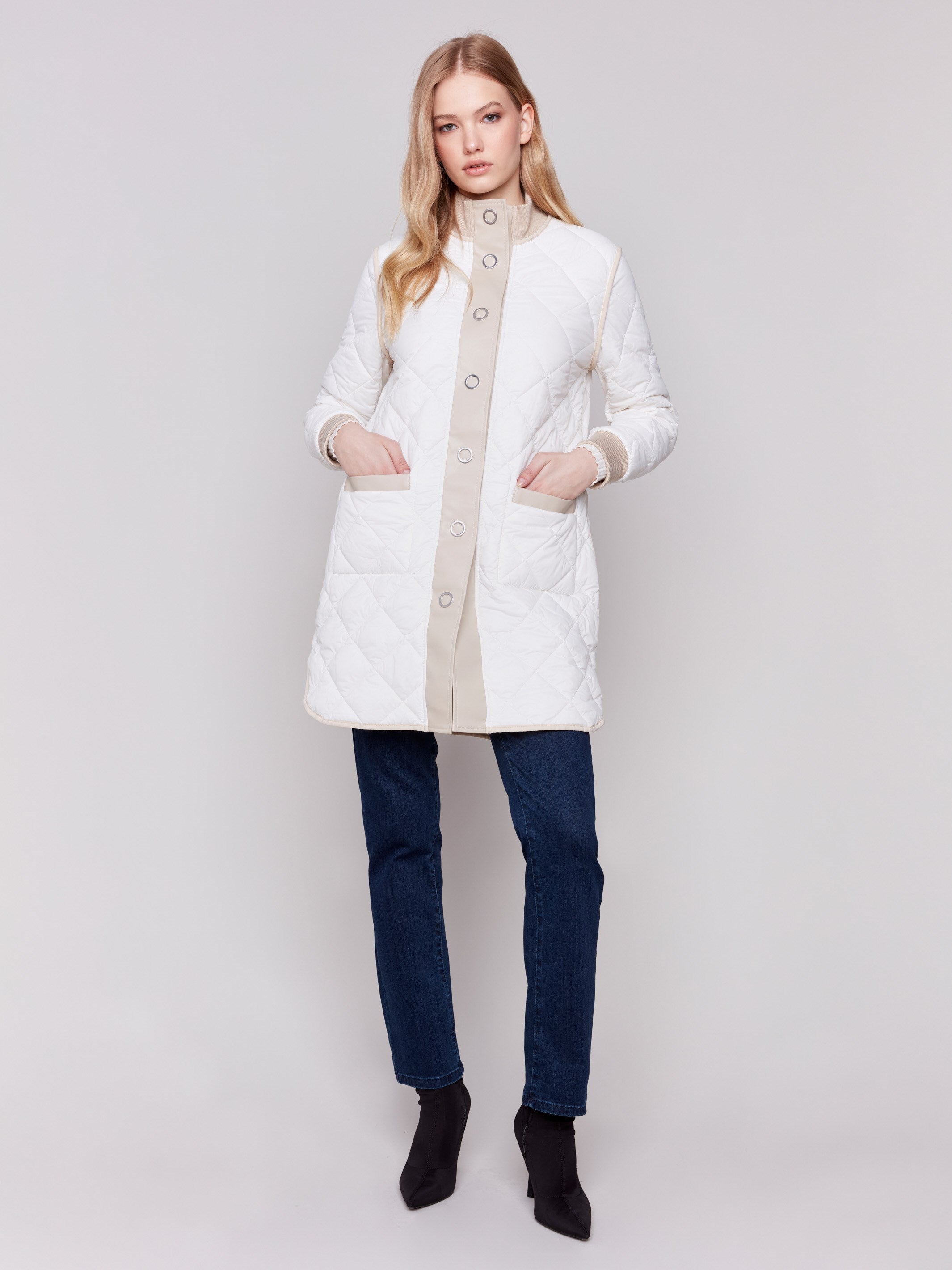 Champagne and white quilted puffer jacket reversible to white with a high collar and patch pockets by Charlie B.