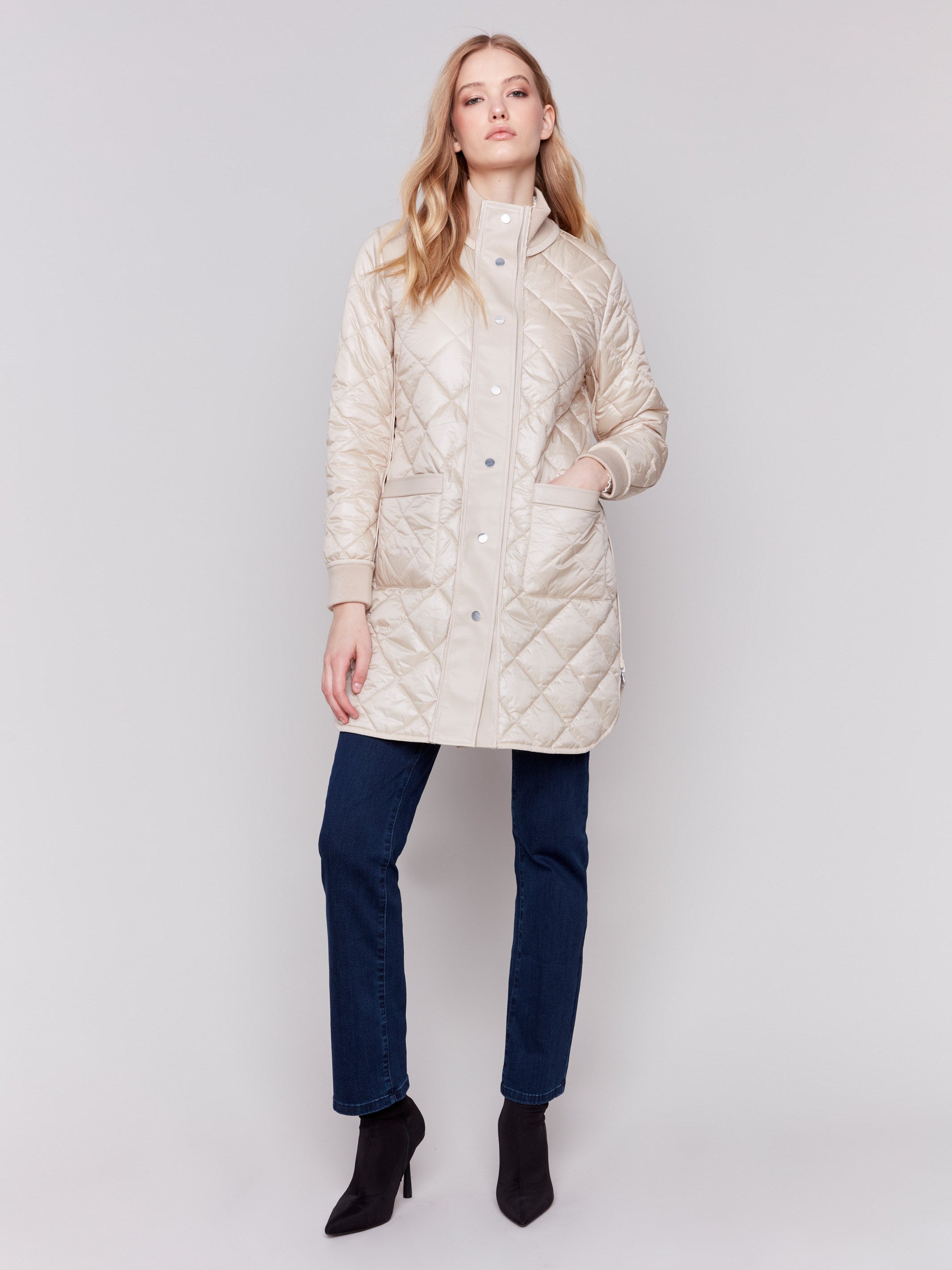 Champagne and white quilted puffer jacket reversible to white with a high collar and patch pockets by Charlie B.