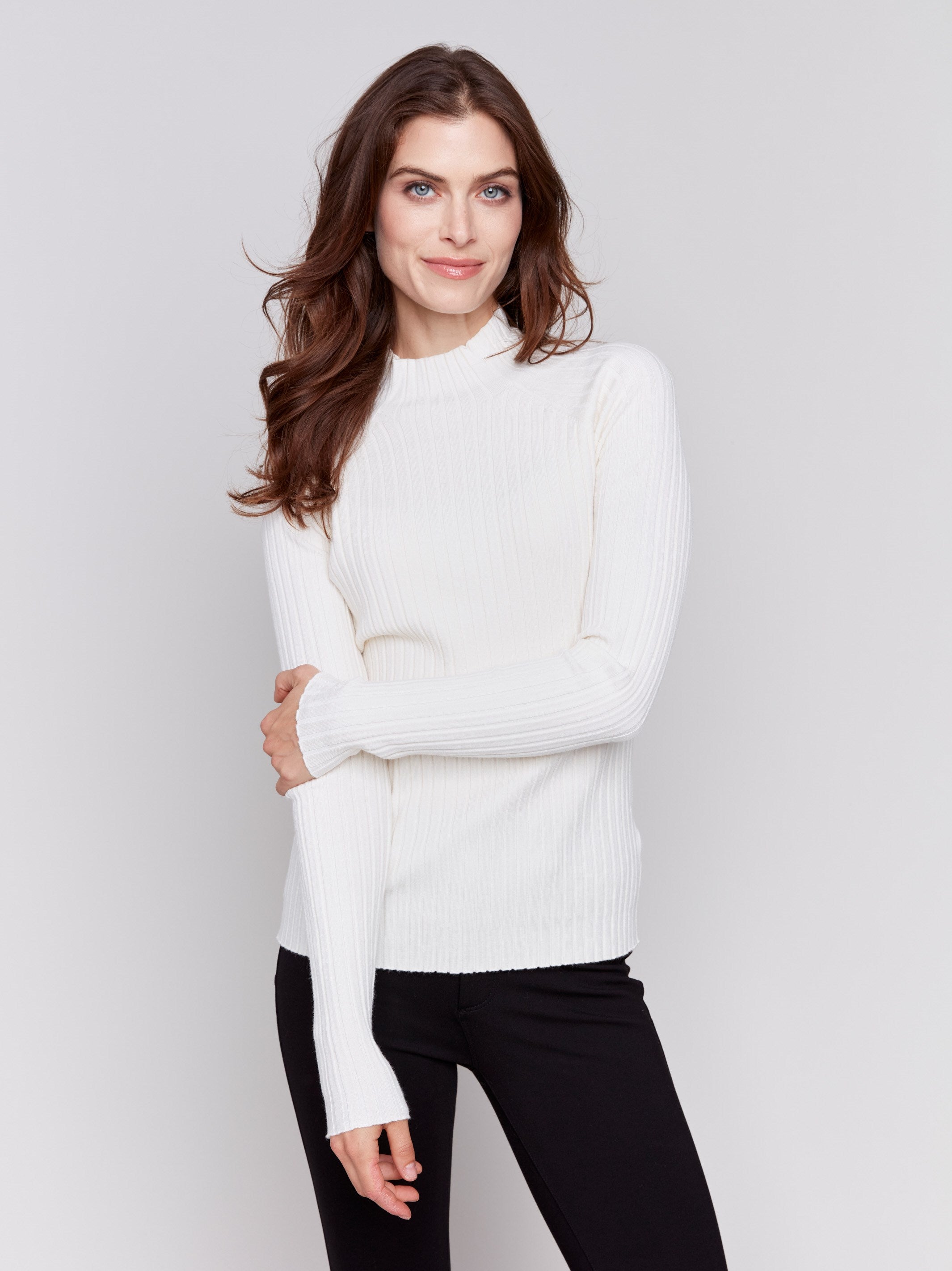 Ecru ribbed knit sweater with a mock neck and long sleeves by Charlie B.