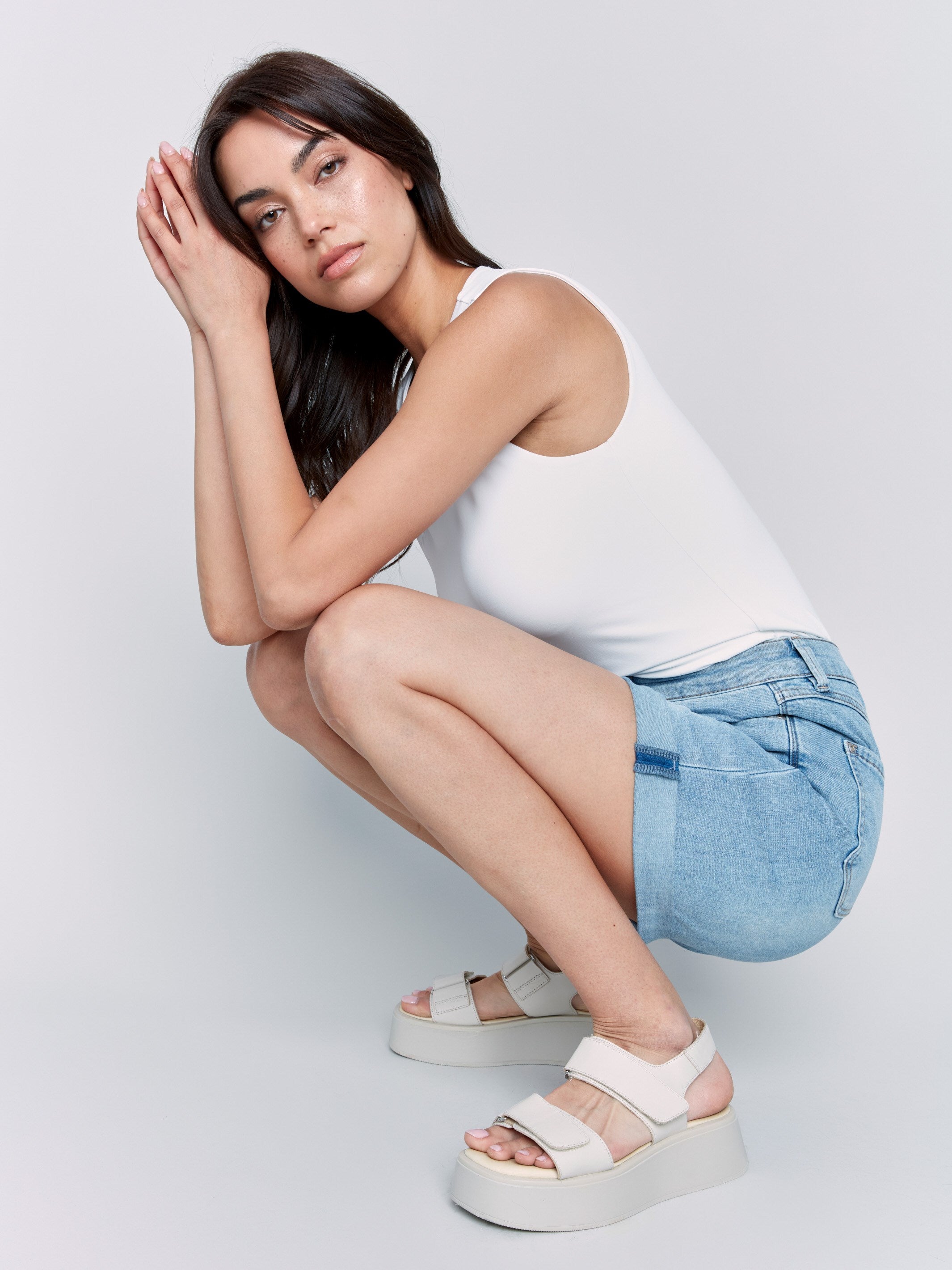 Stylish rolled cuff denim shorts with a classic look in light blue by Charlie B.