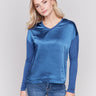 Blue satin and jersey top featuring V-neck design and long sleeves by Charlie B.