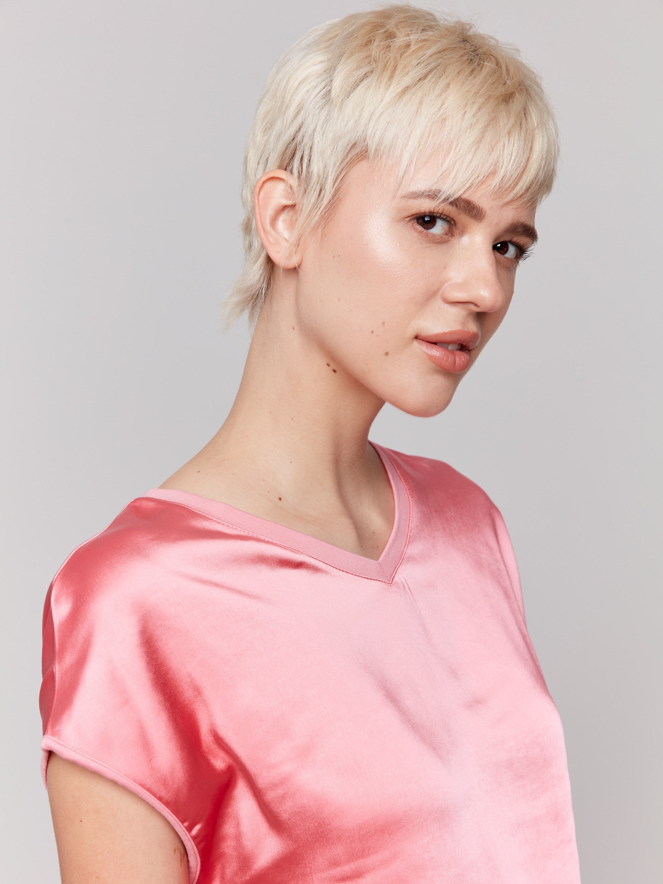 Pink satin V-neck top with dolman sleeves by Charlie B.