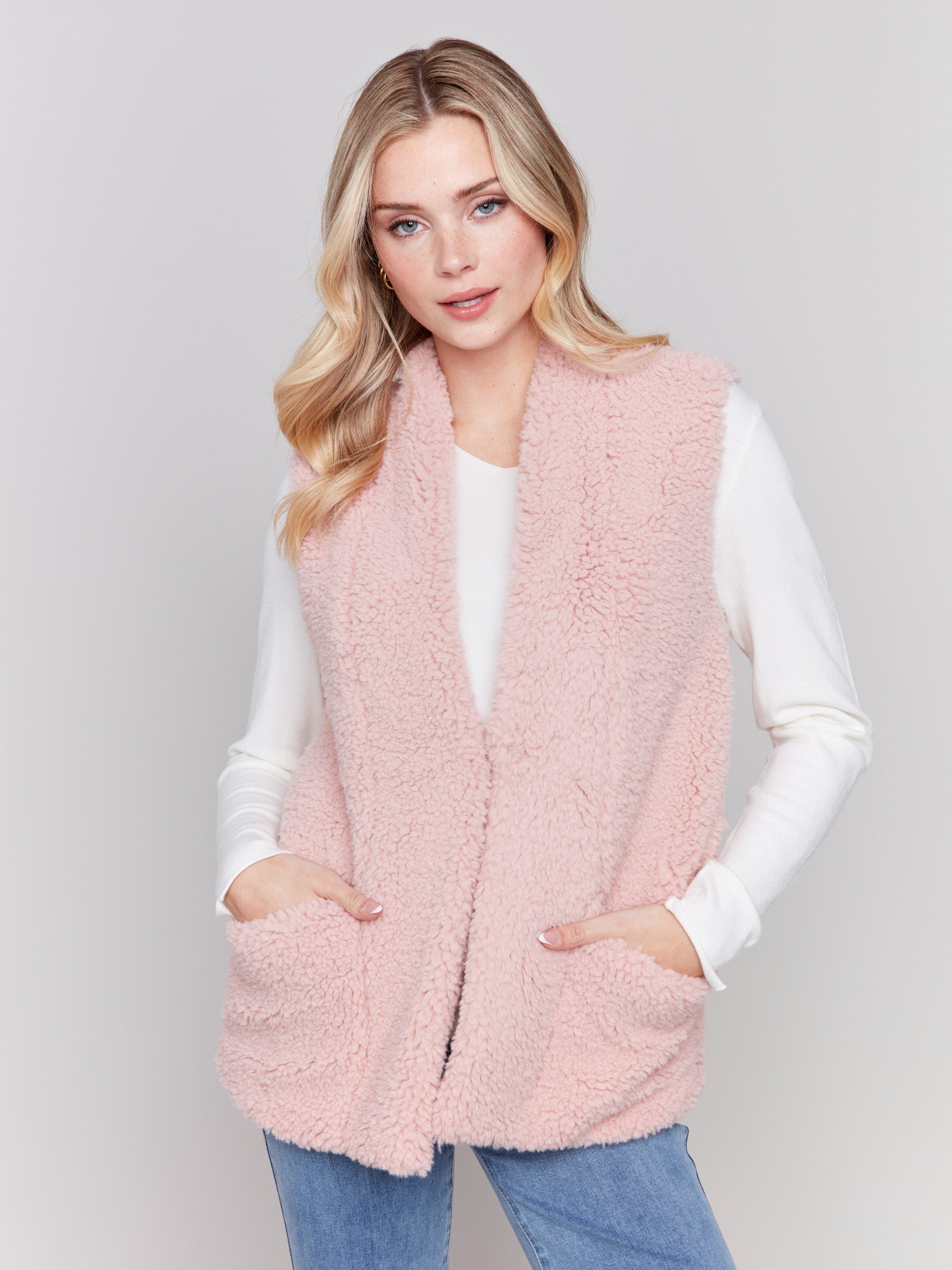 Short quartz pink faux fur vest with open front by Charlie B.