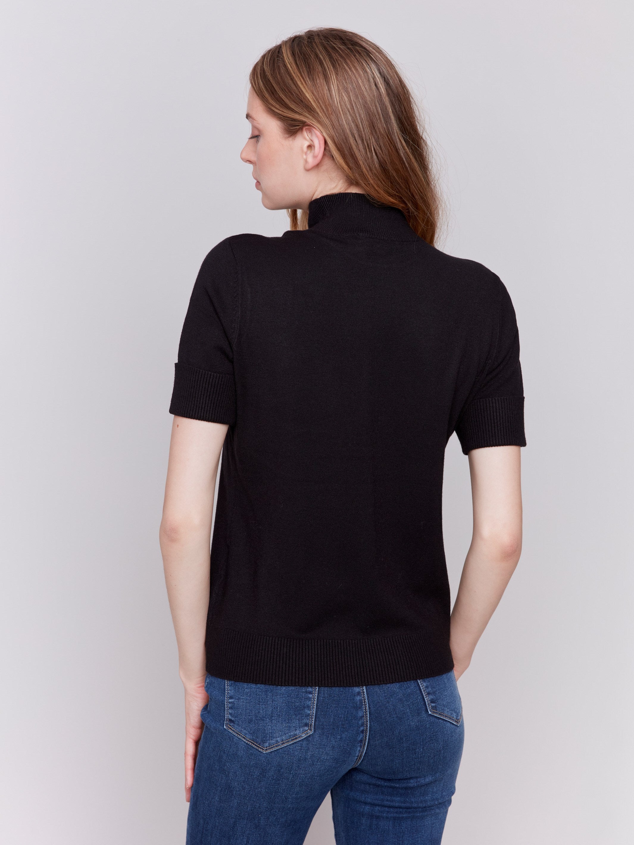 Black short sleeve mock neck sweater with ribbed cuffs and hem by Charlie B.