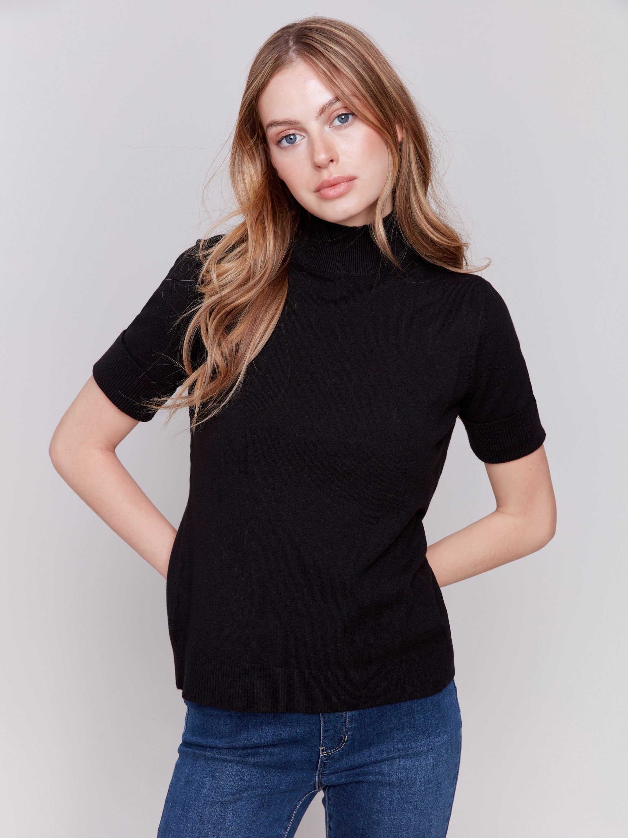 Black short sleeve mock neck sweater with ribbed cuffs and hem by Charlie B.