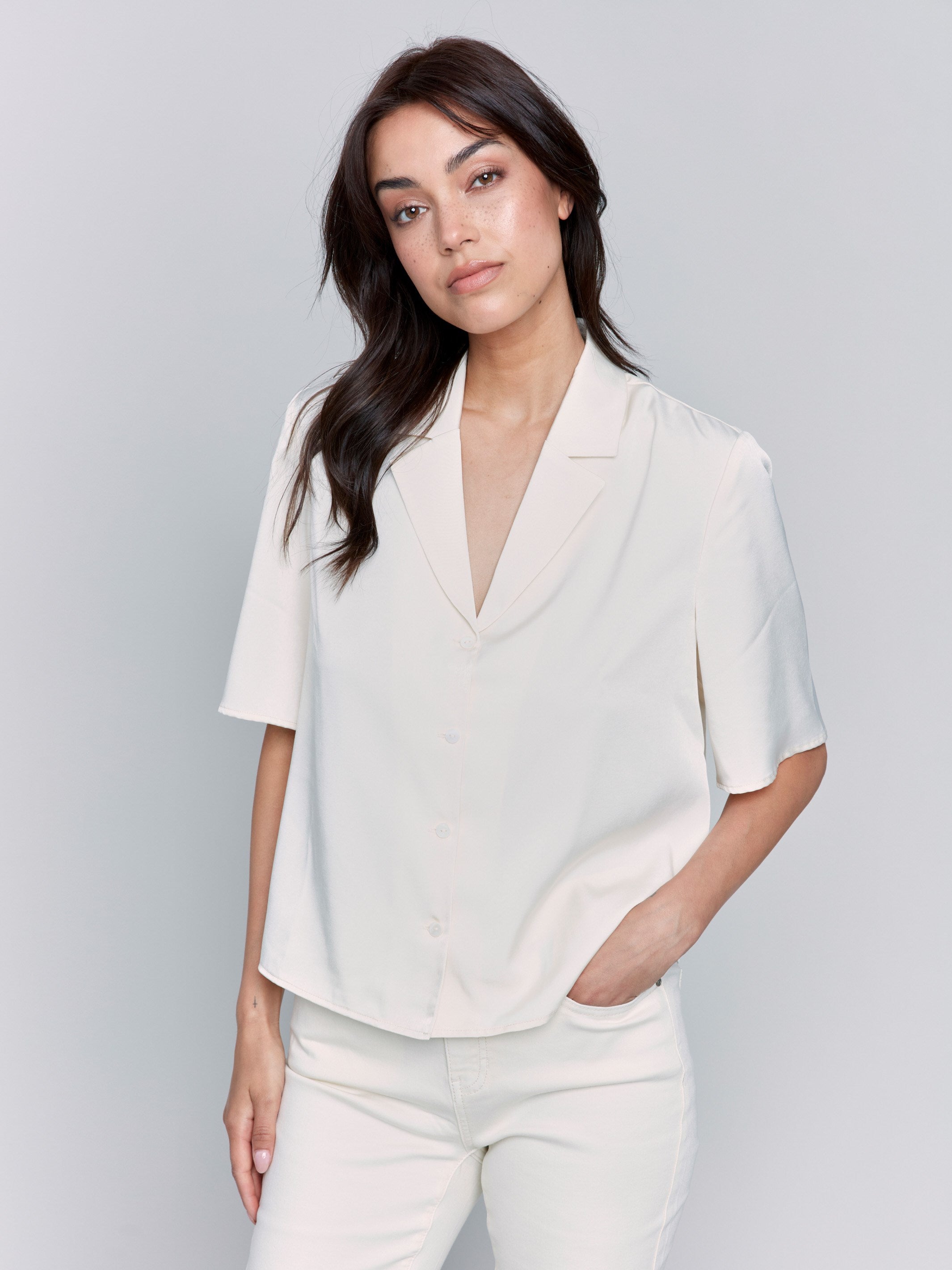 Ecru satin shirt featuring a tailored collar by Charlie B.