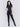 Black skinny twill pants with a mid-rise waist, skinny fit, and front zipper pocket detail by Charlie B.