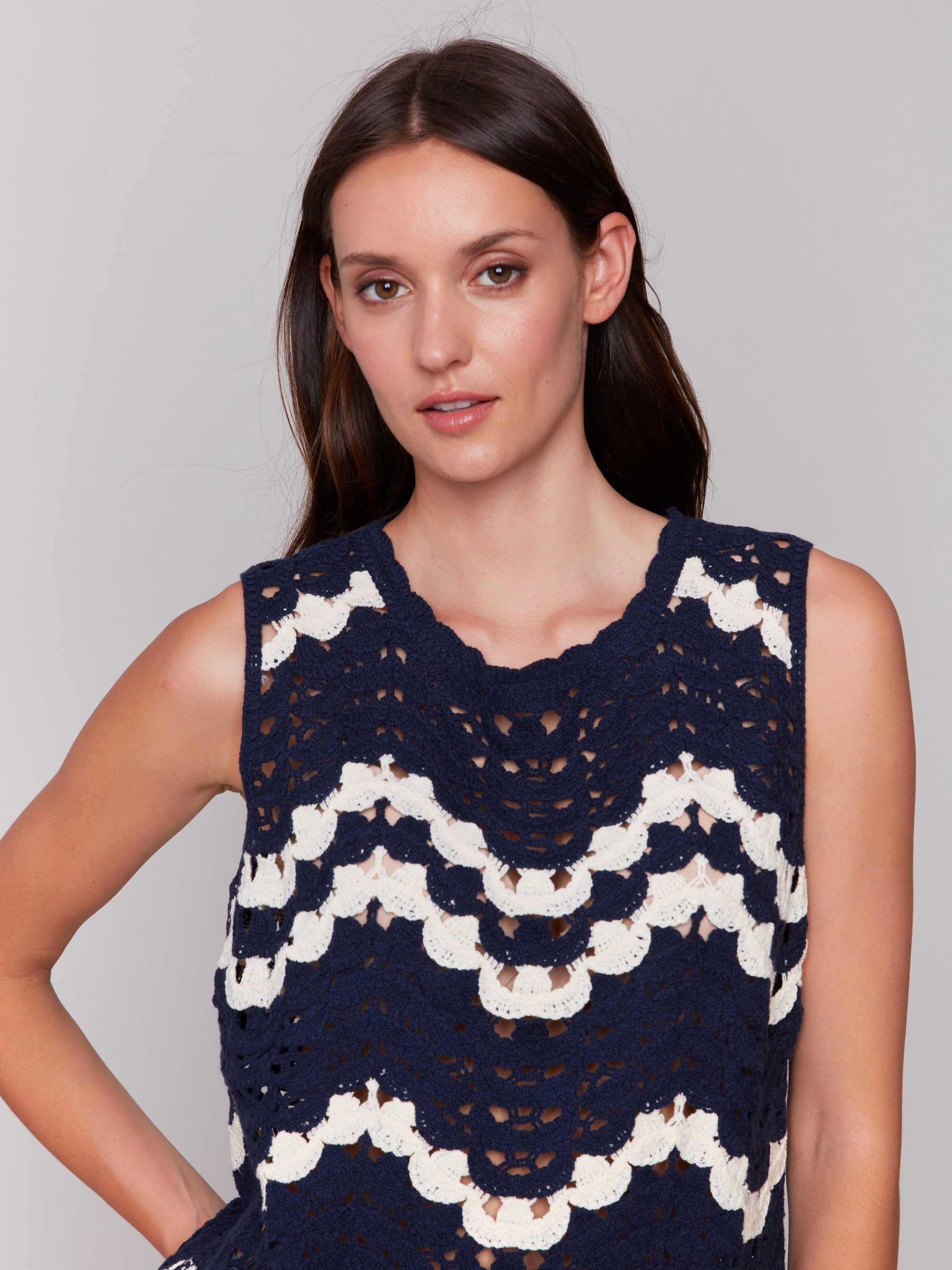 Sleeveless navy crochet top with intricate wave patterns by Charlie B.