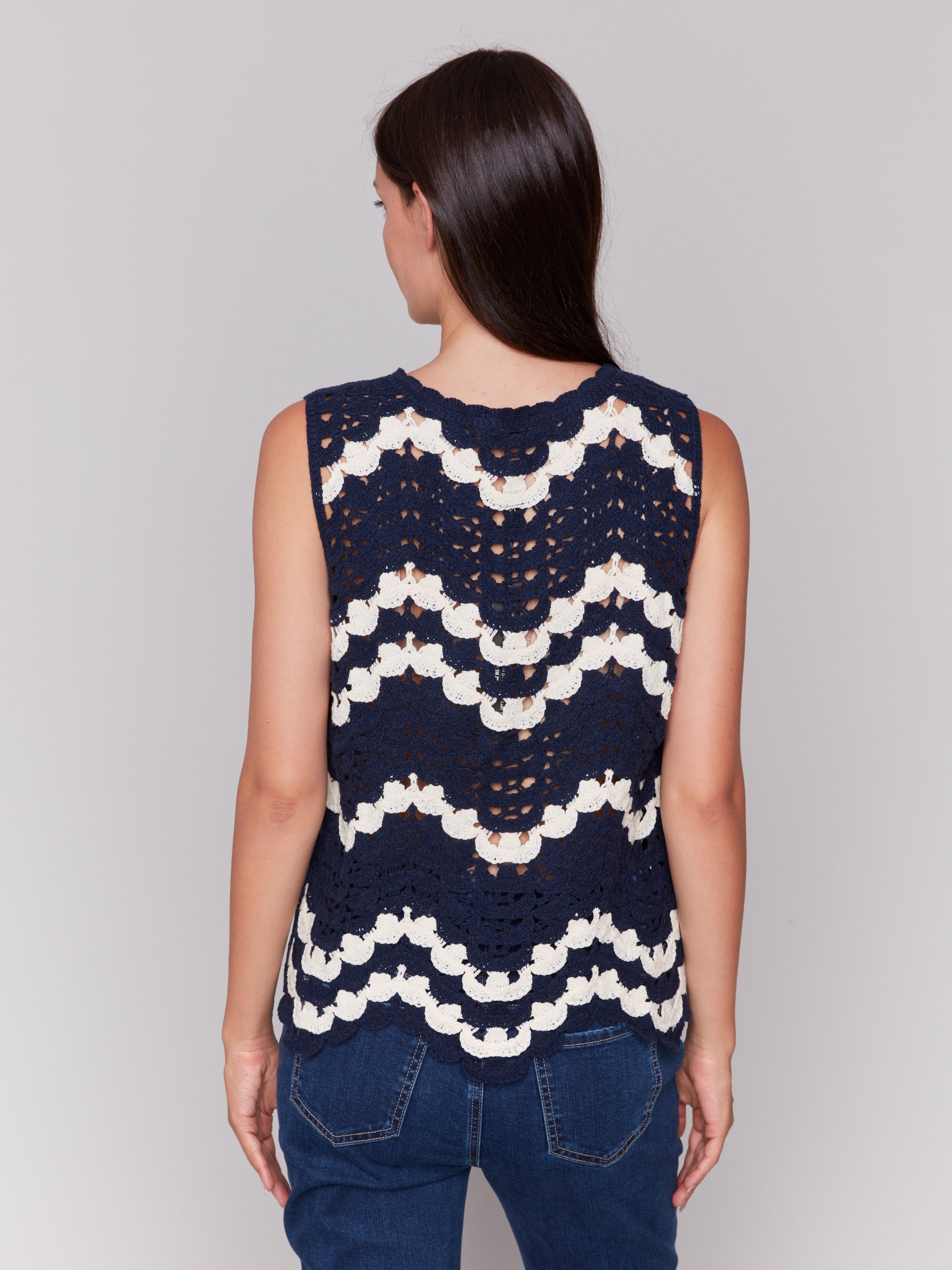 Elegant navy crochet top showcasing a sleeveless design by Charlie B.