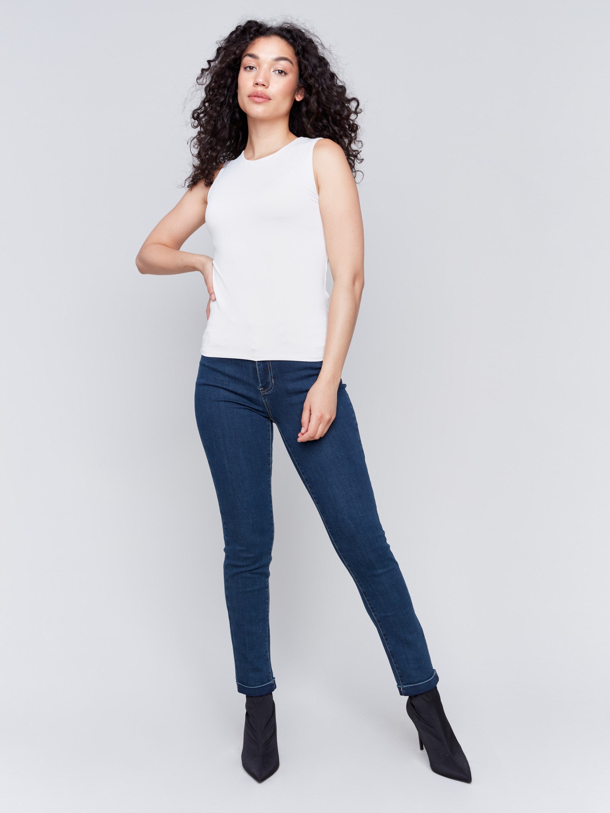 Natural white sleeveless super stretch top with a crew neckline by Charlie B.