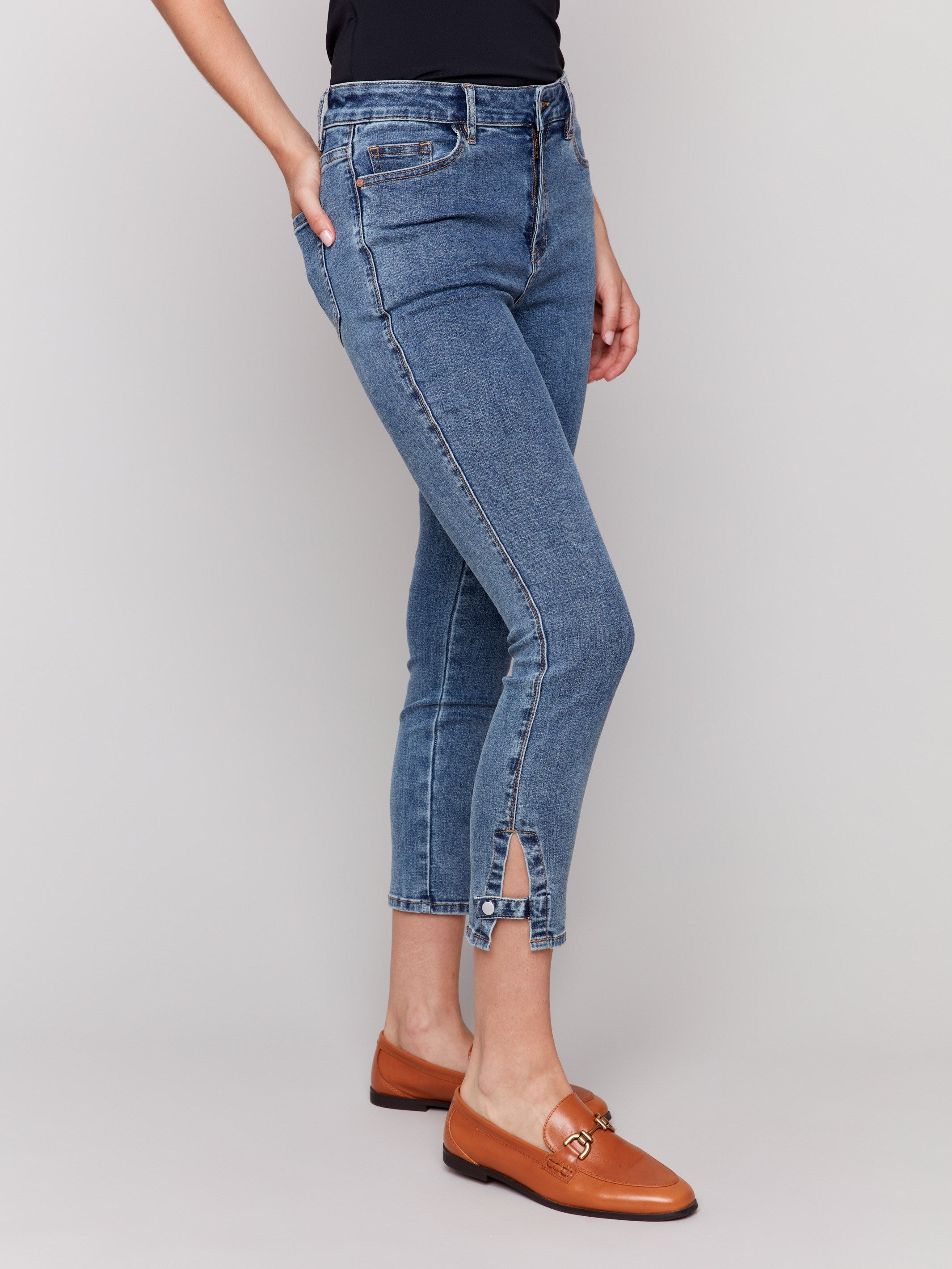 Stylish medium blue cropped length jeans featuring side mini tabs by Charlie B.